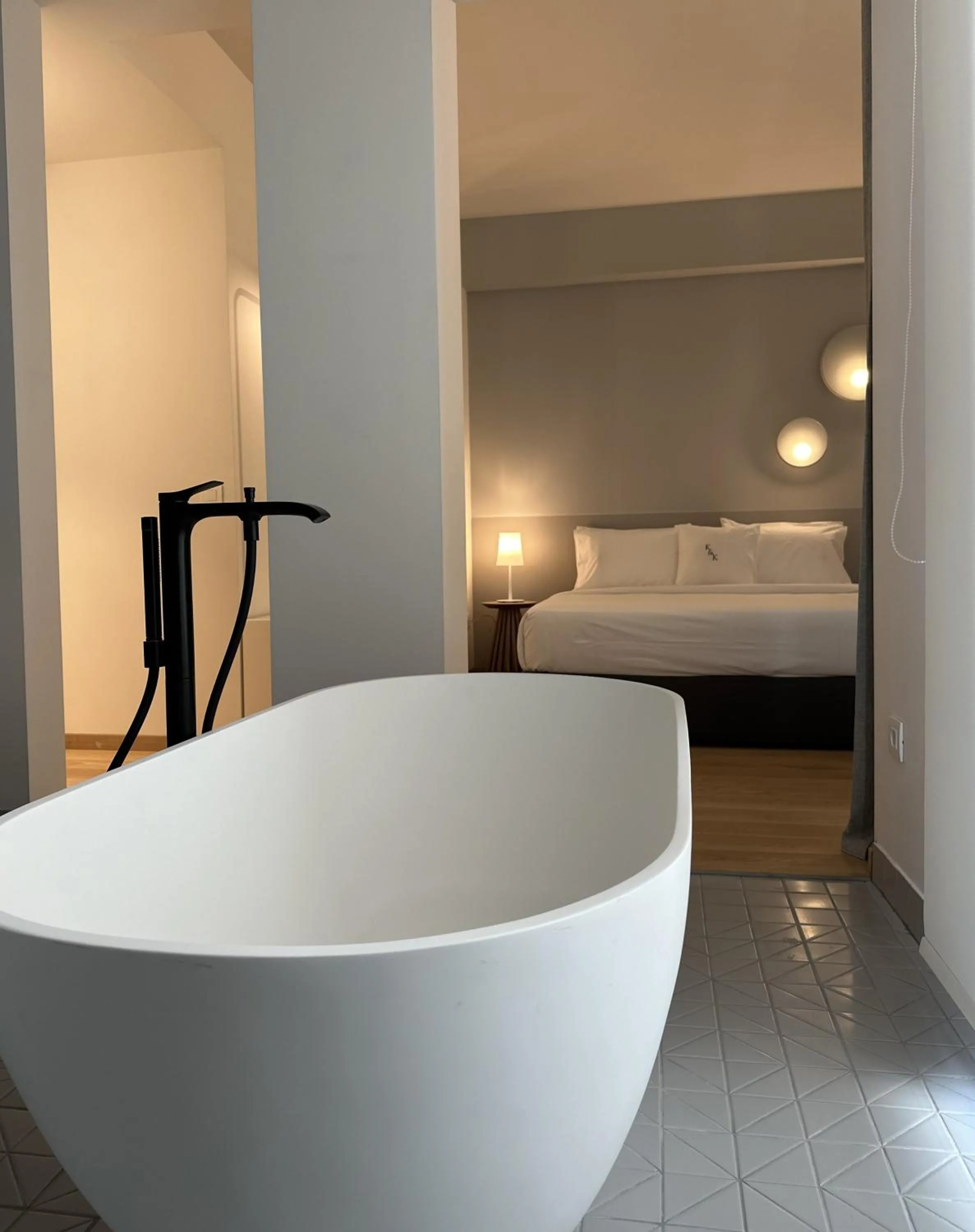 Bed in AIONION RESIDENCES by K&K