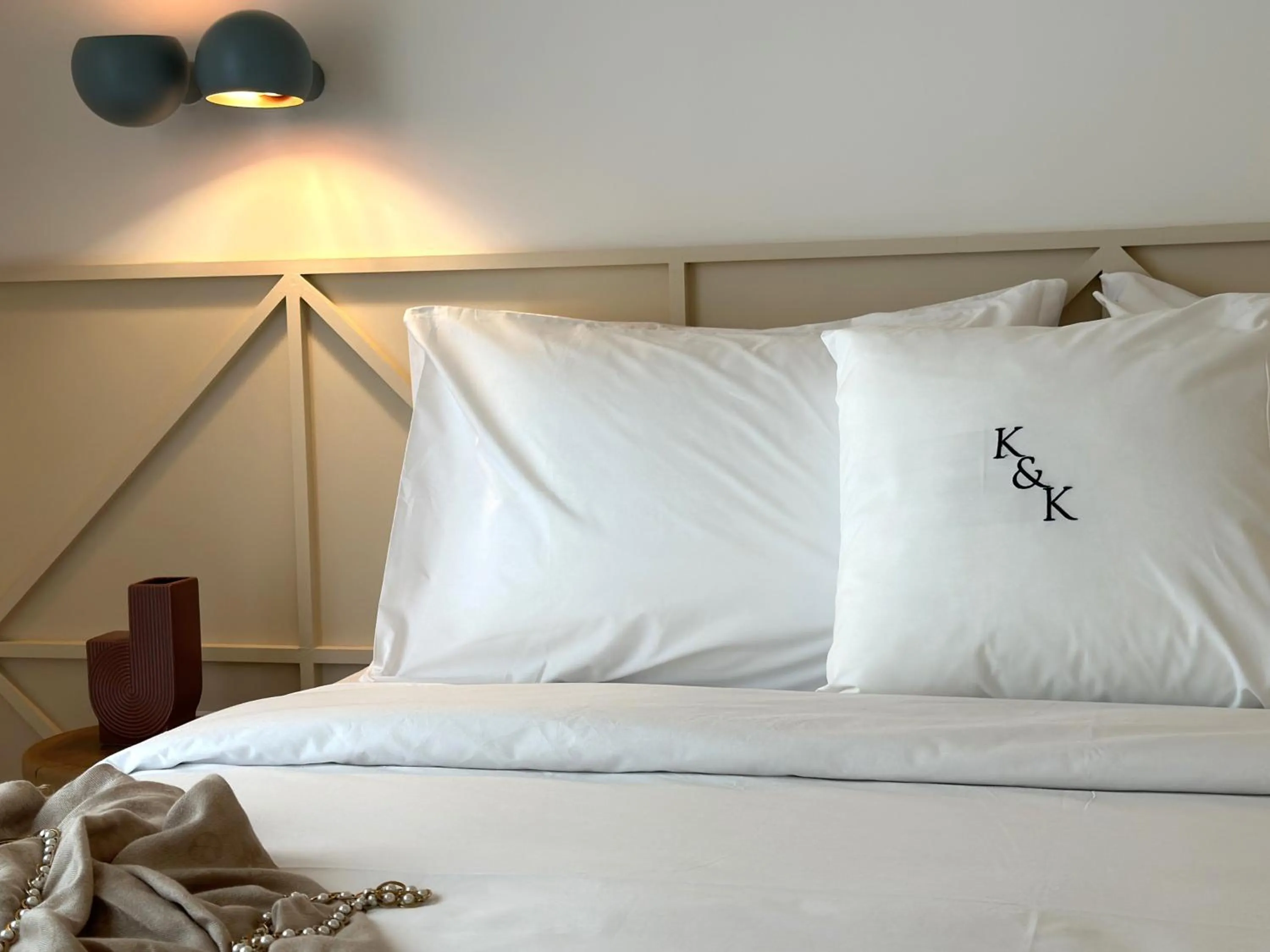 Bed in AIONION RESIDENCES by K&K