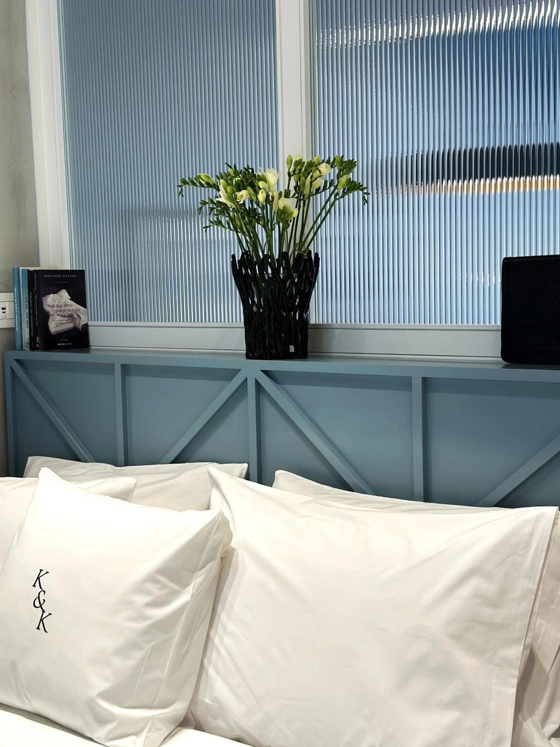 Bed in AIONION RESIDENCES by K&K