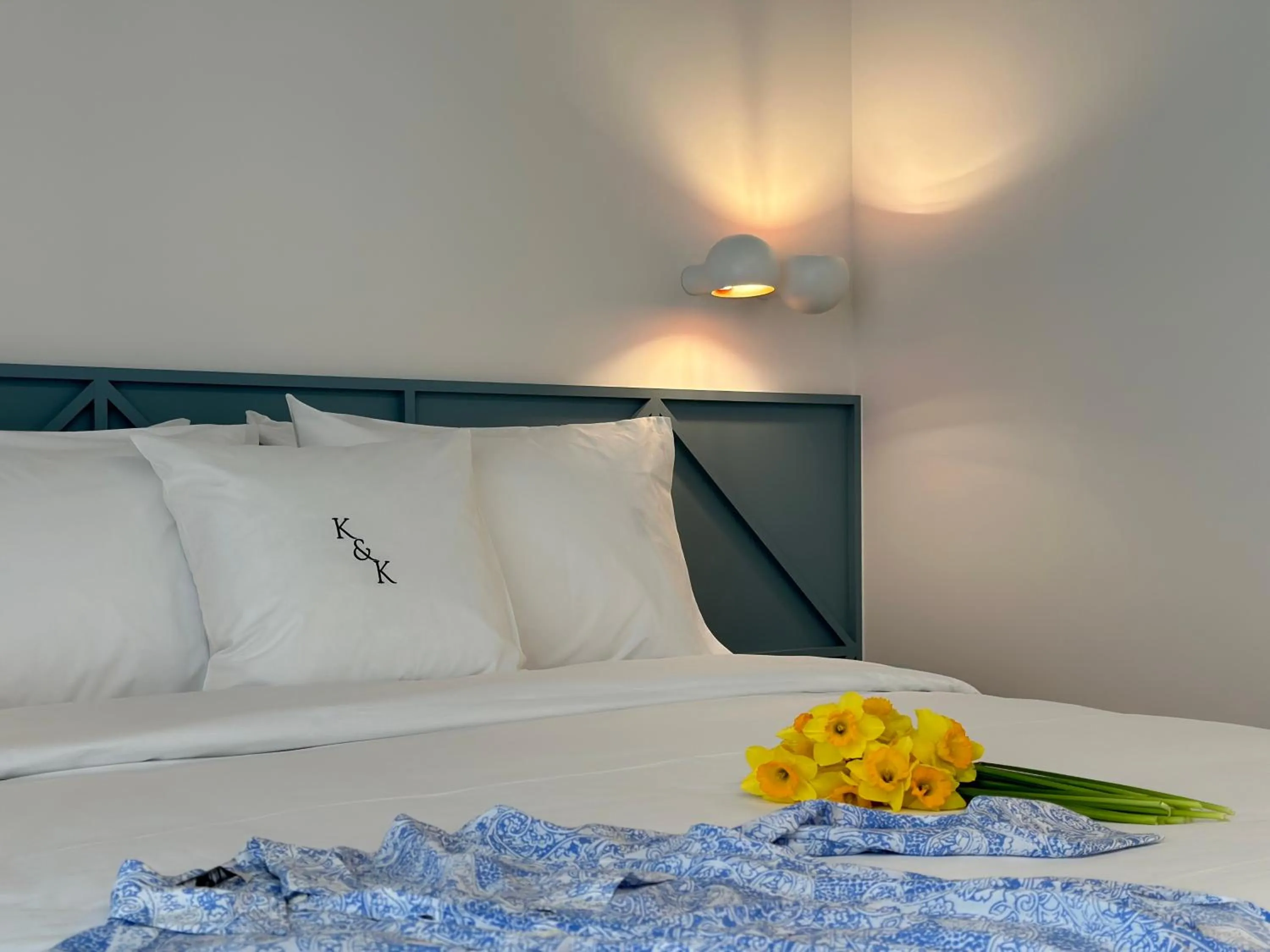 Bed in AIONION RESIDENCES by K&K