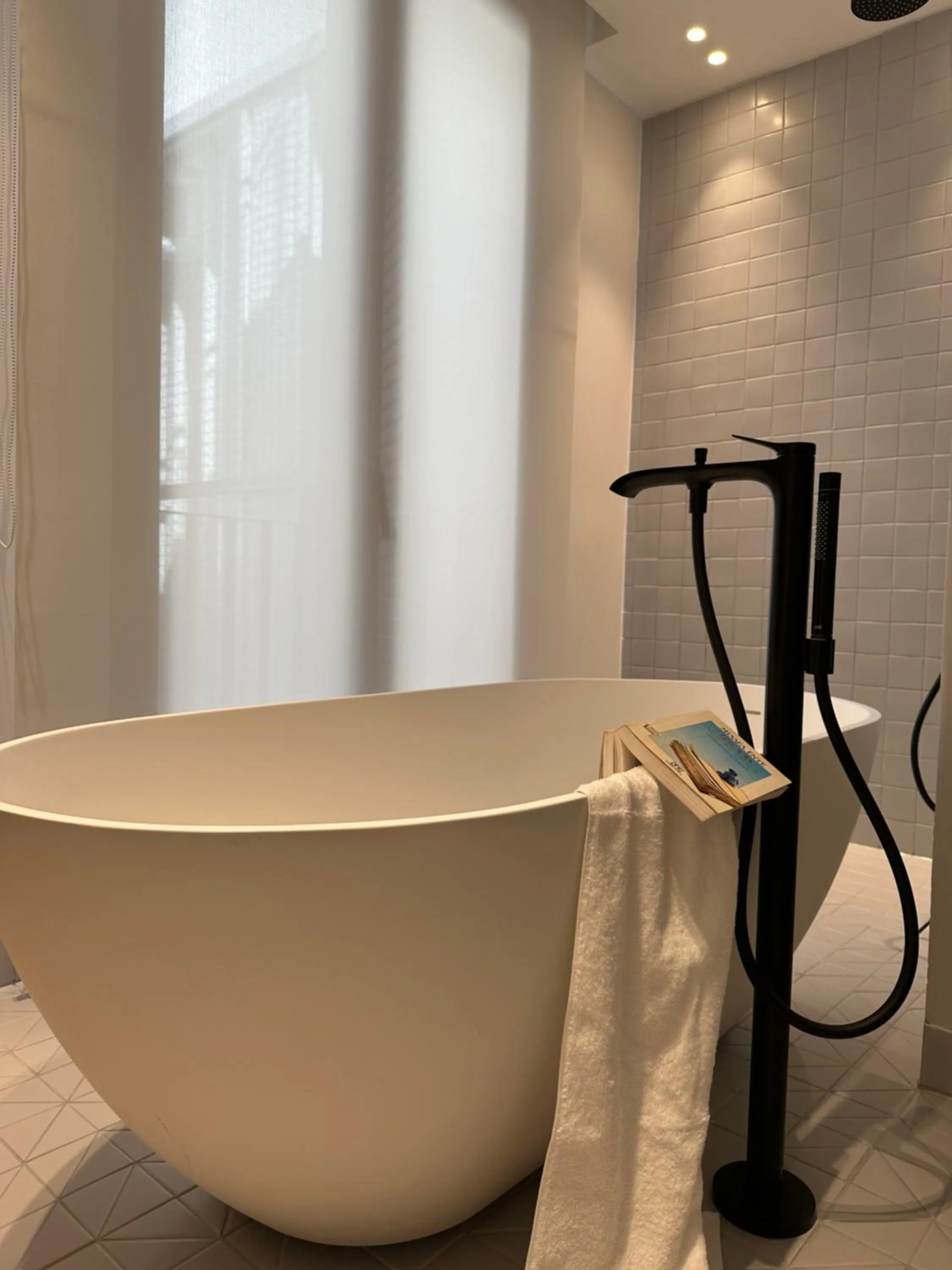 Bathroom in AIONION RESIDENCES by K&K