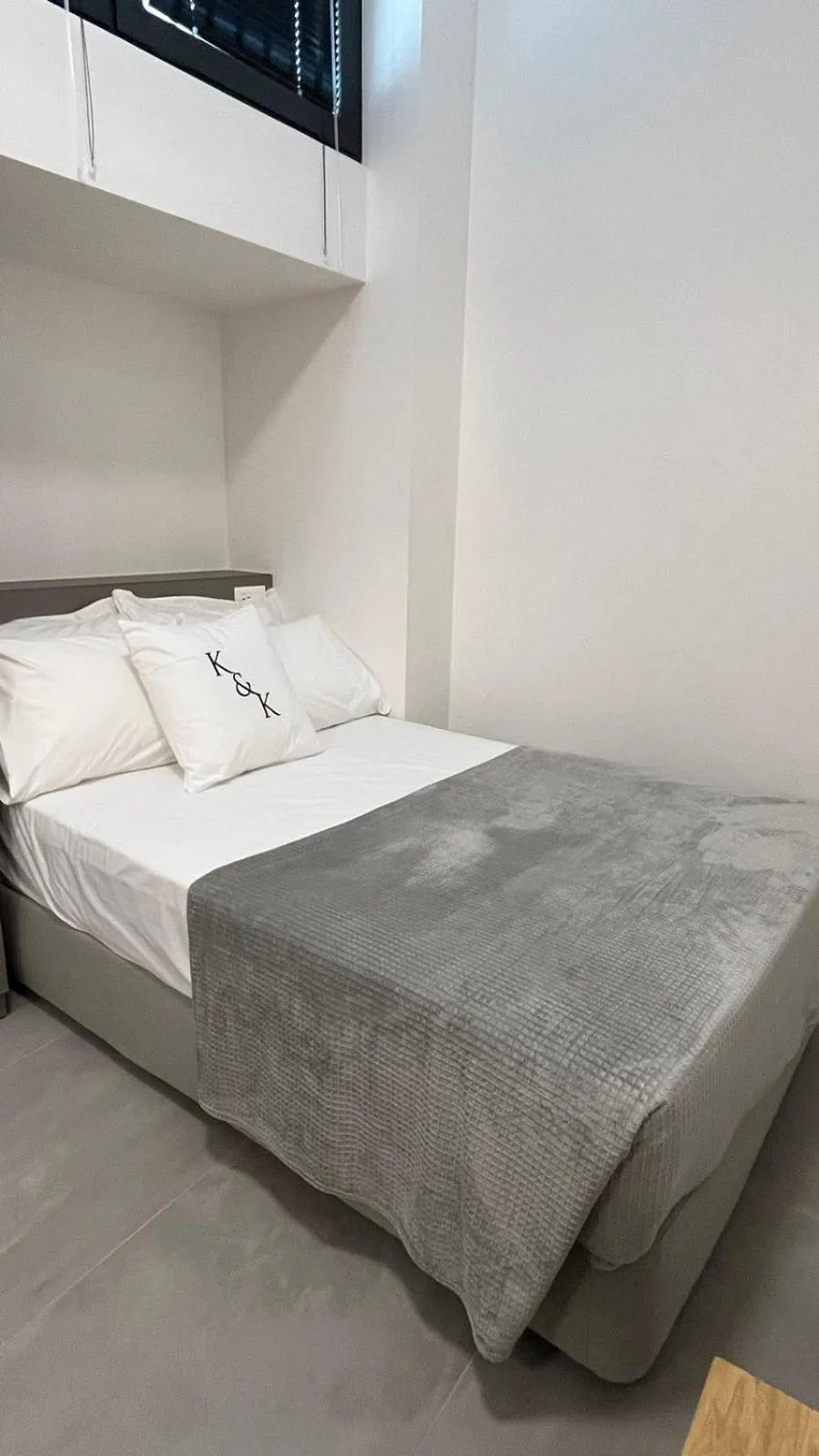 Bed in AIONION RESIDENCES by K&K