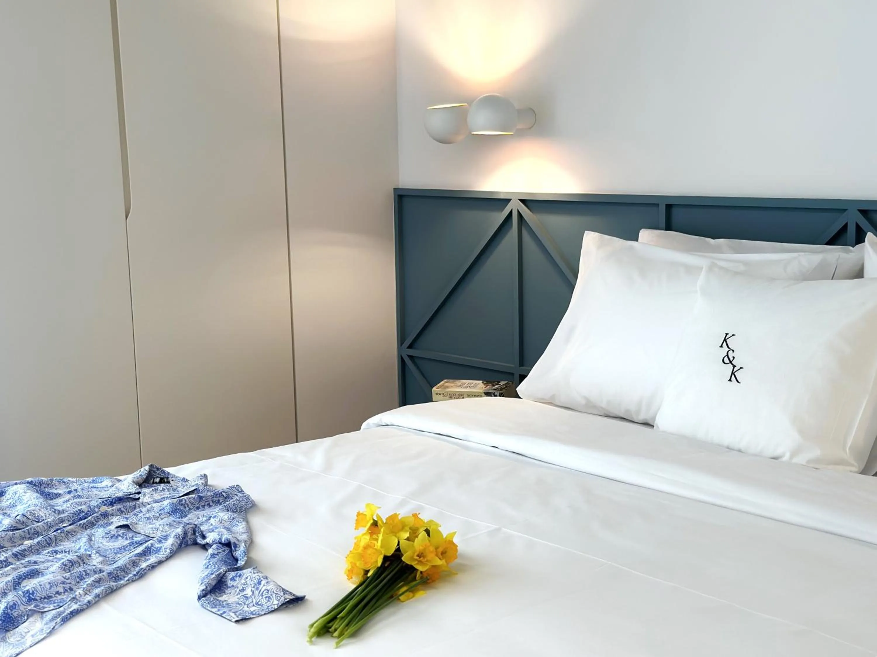 Bed in AIONION RESIDENCES by K&K