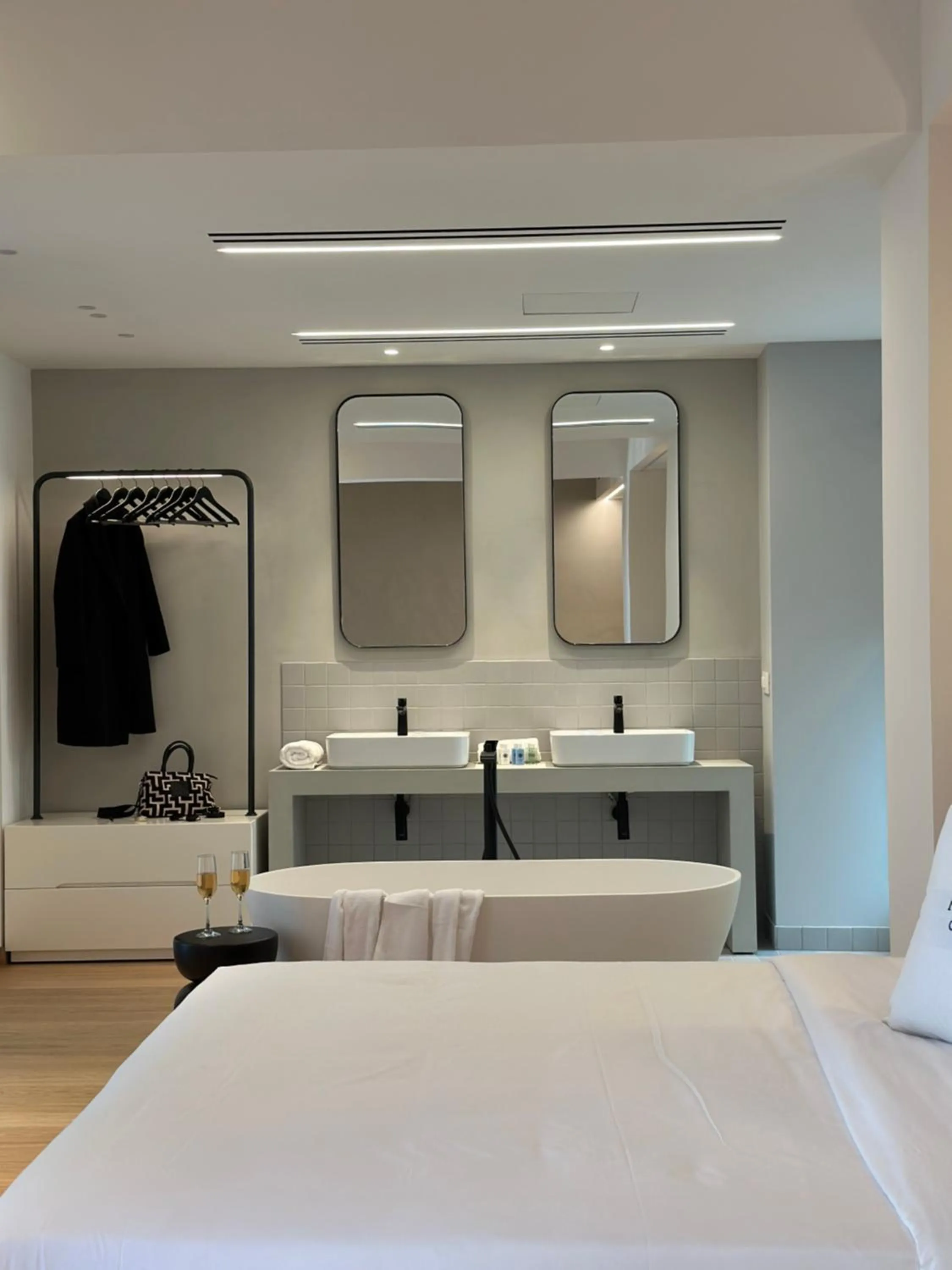 Bed in AIONION RESIDENCES by K&K