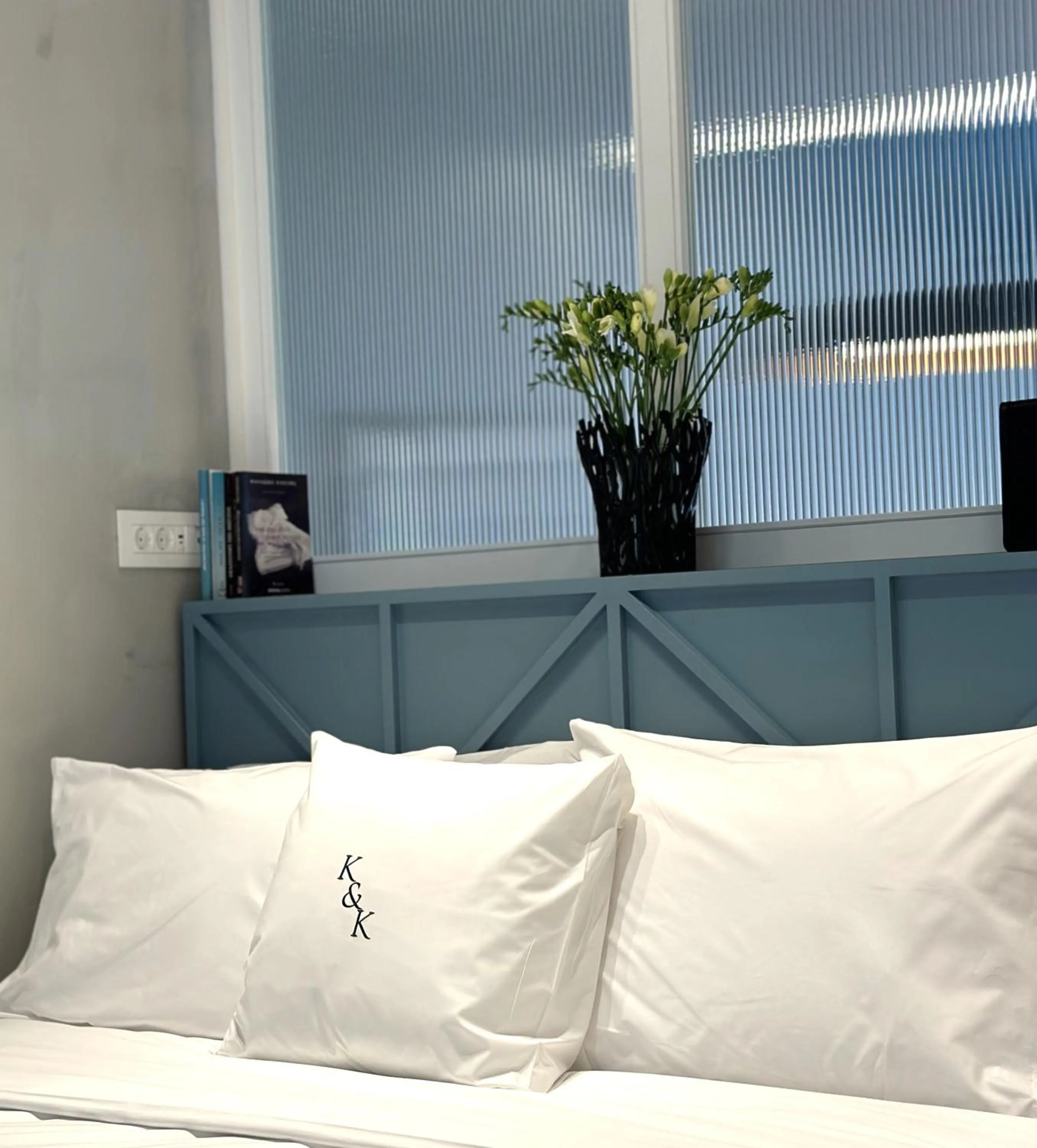 Bed in AIONION RESIDENCES by K&K