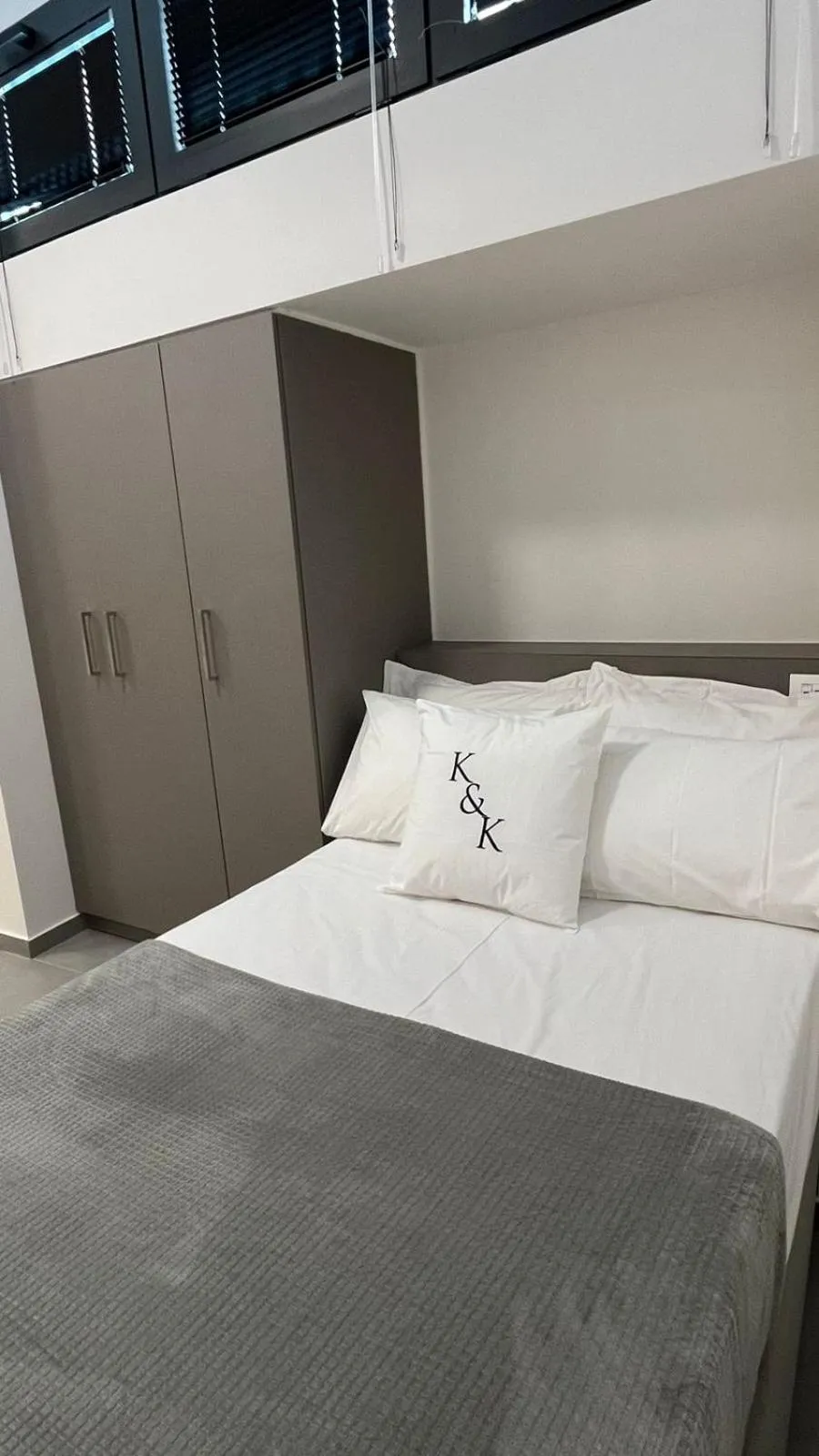 Bed in AIONION RESIDENCES by K&K