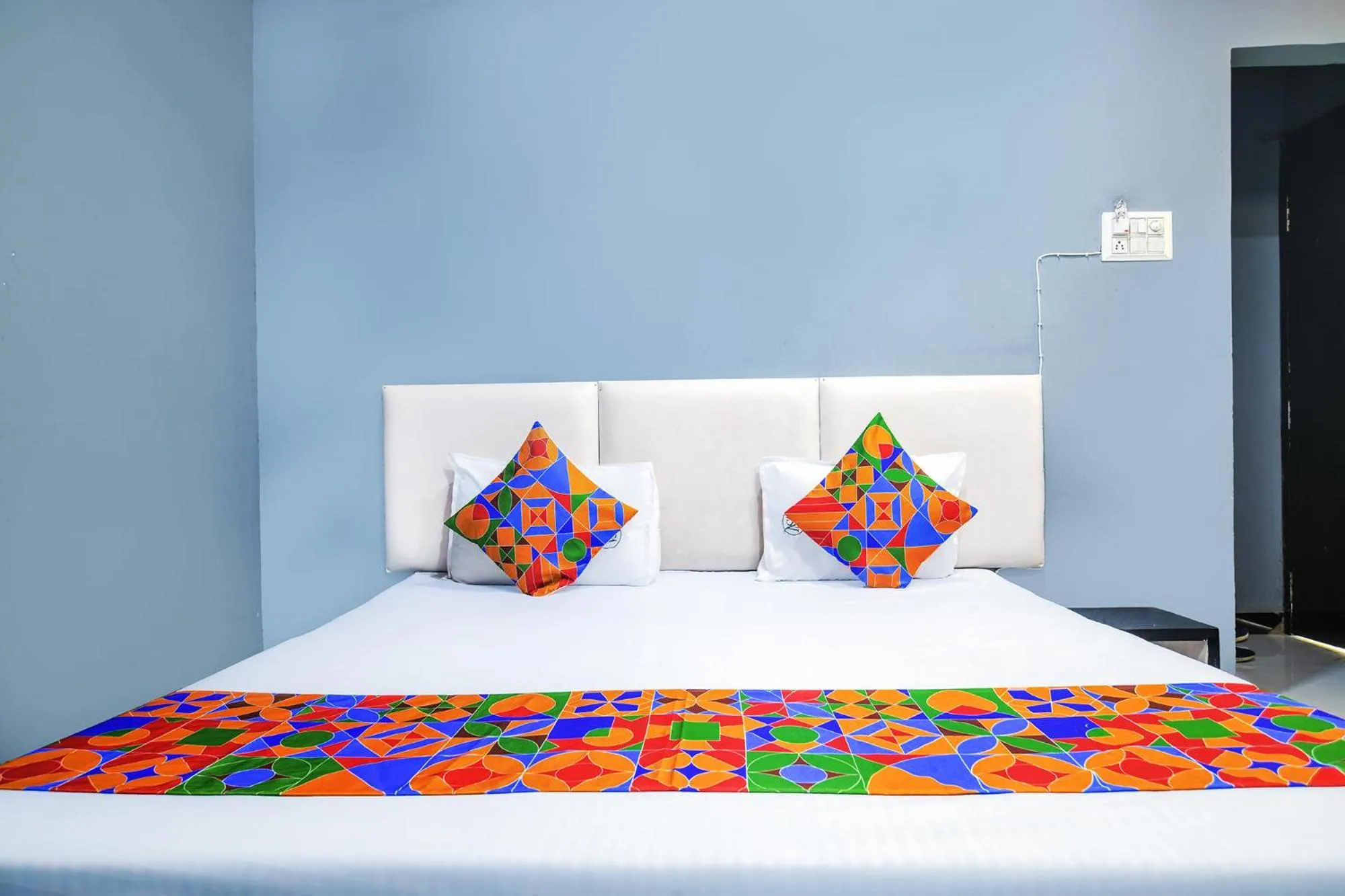 Bed in FabHotel Shree Moti Palace