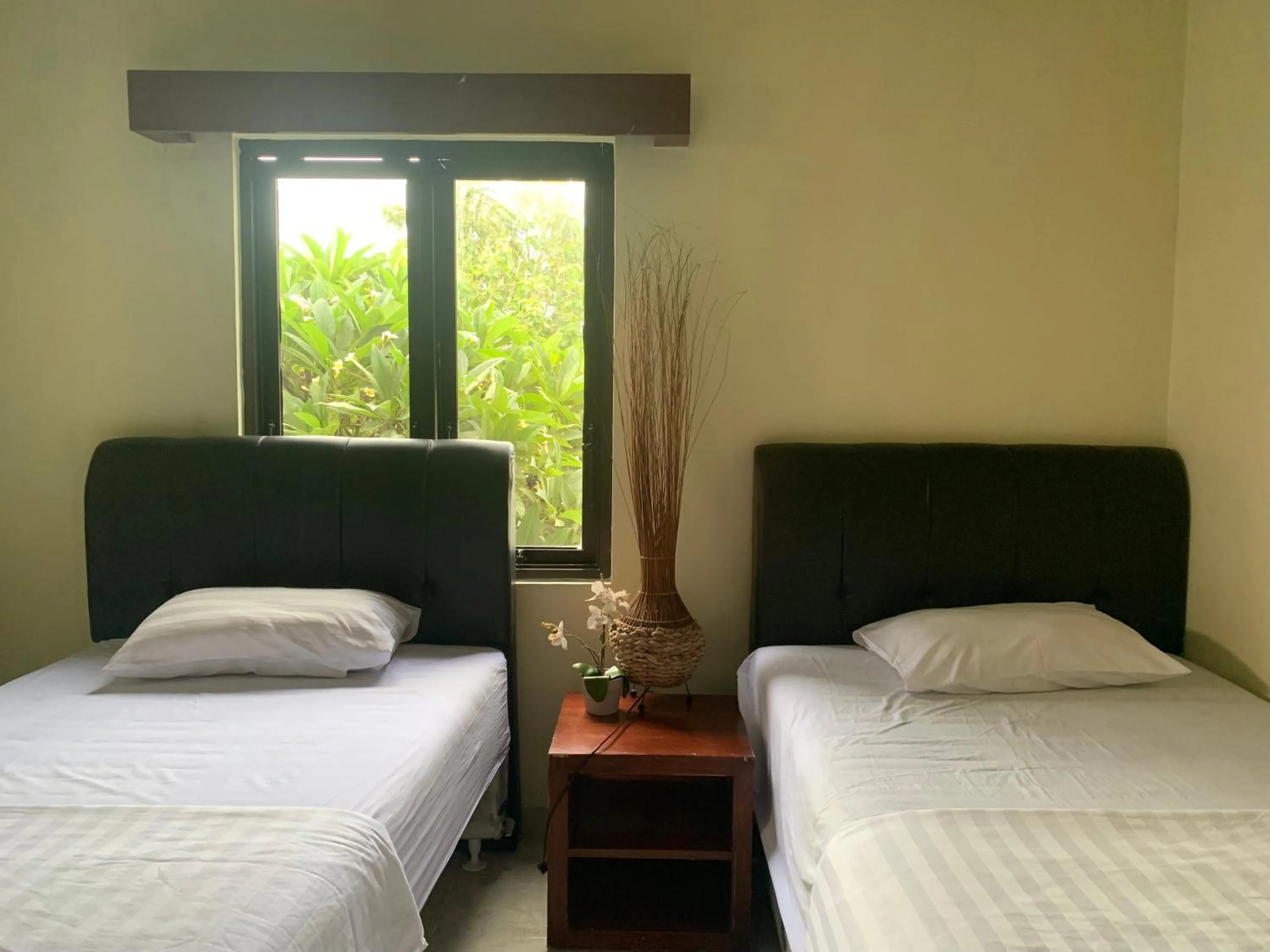 Bed in Cozy Palm Villa