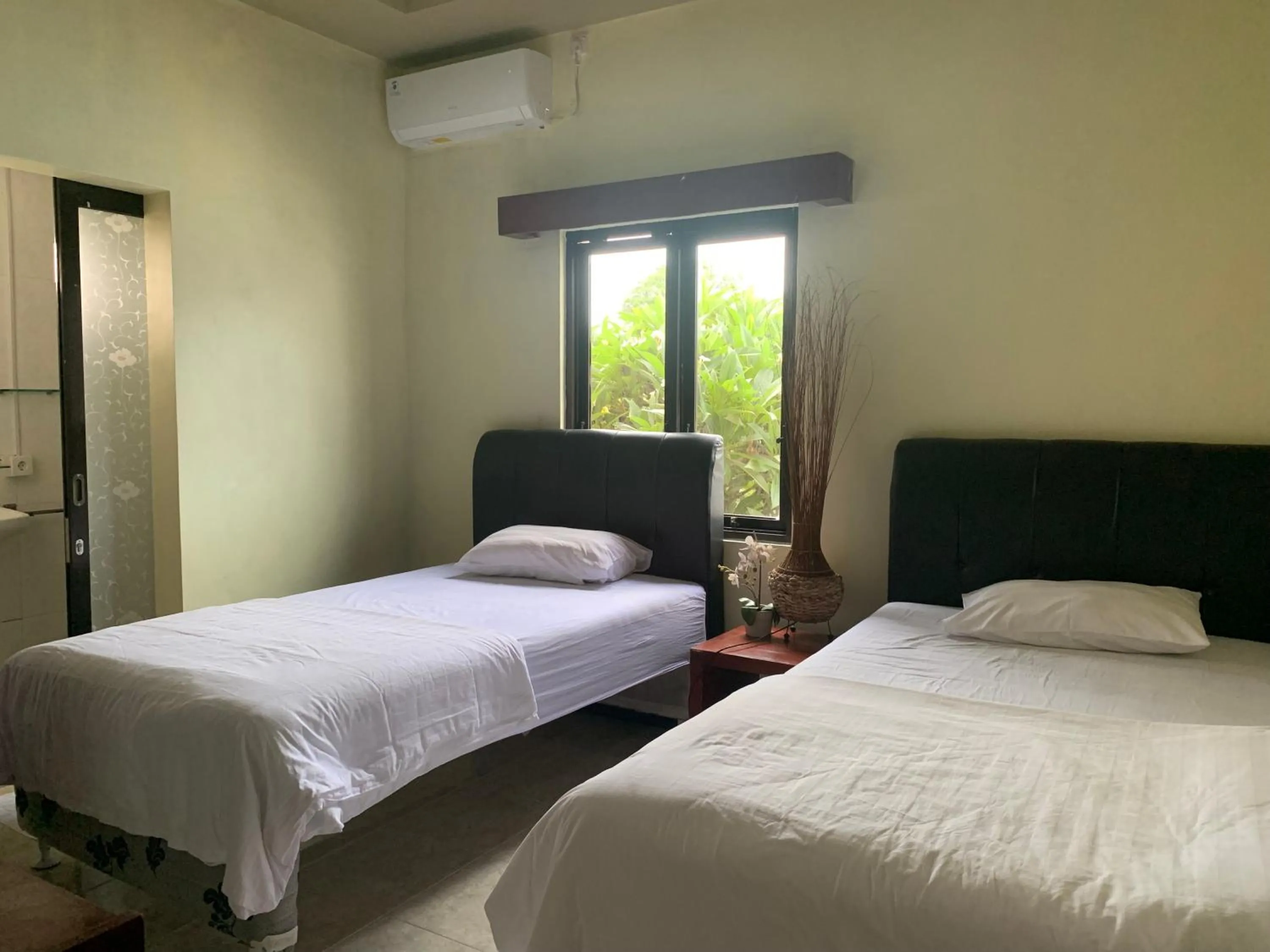 Bed in Cozy Palm Villa