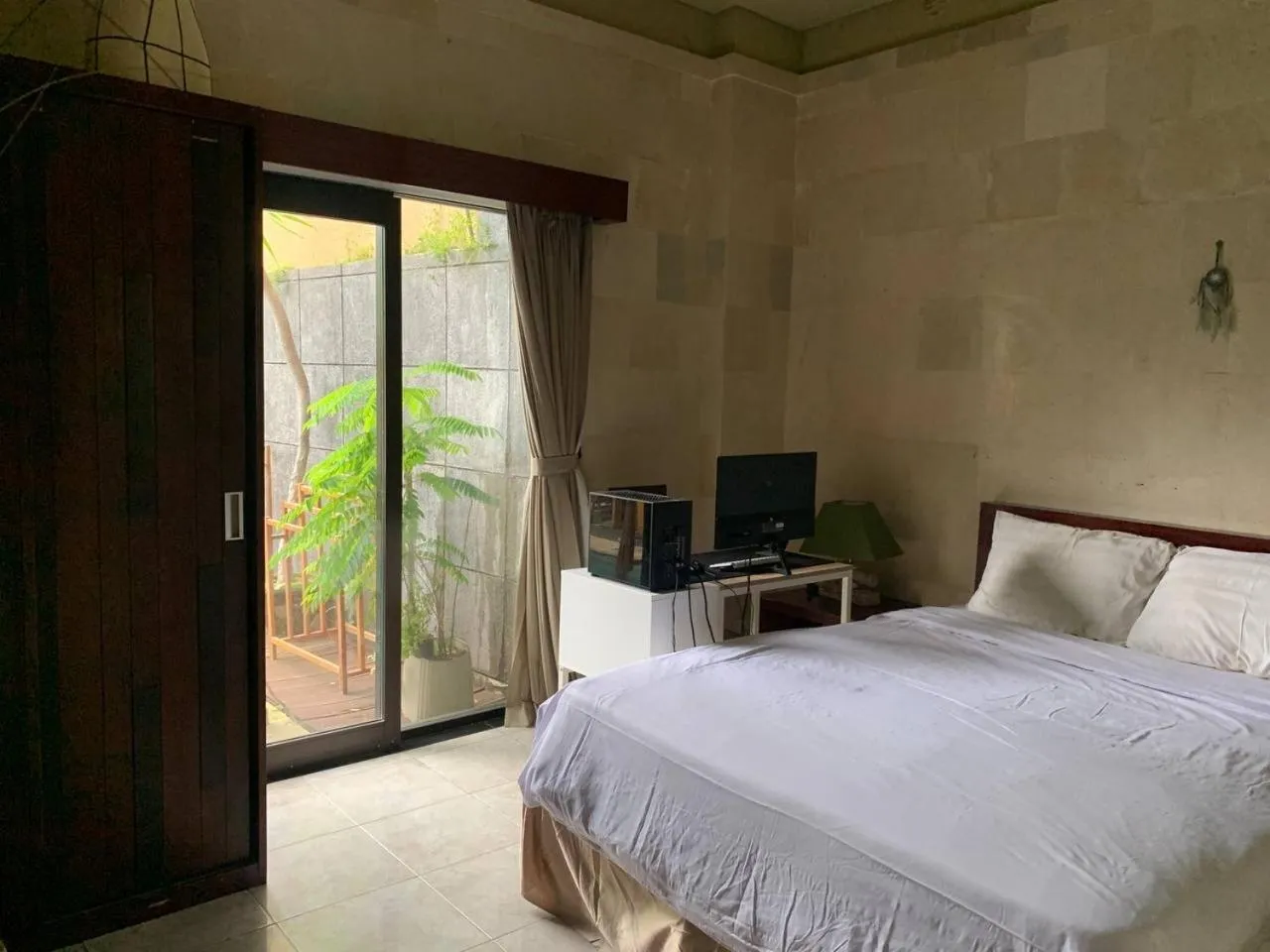 Bed in Cozy Palm Villa