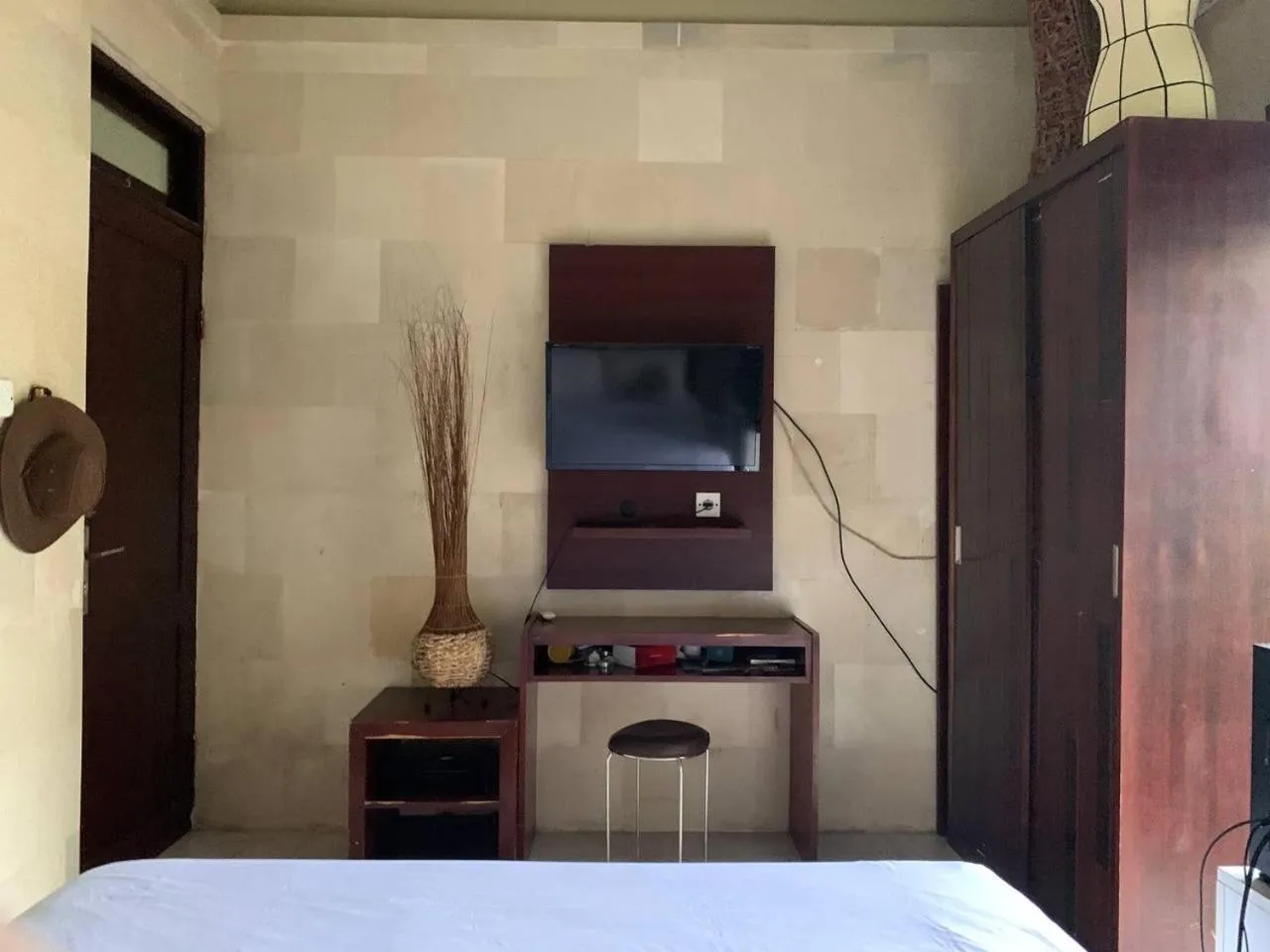 Bed in Cozy Palm Villa