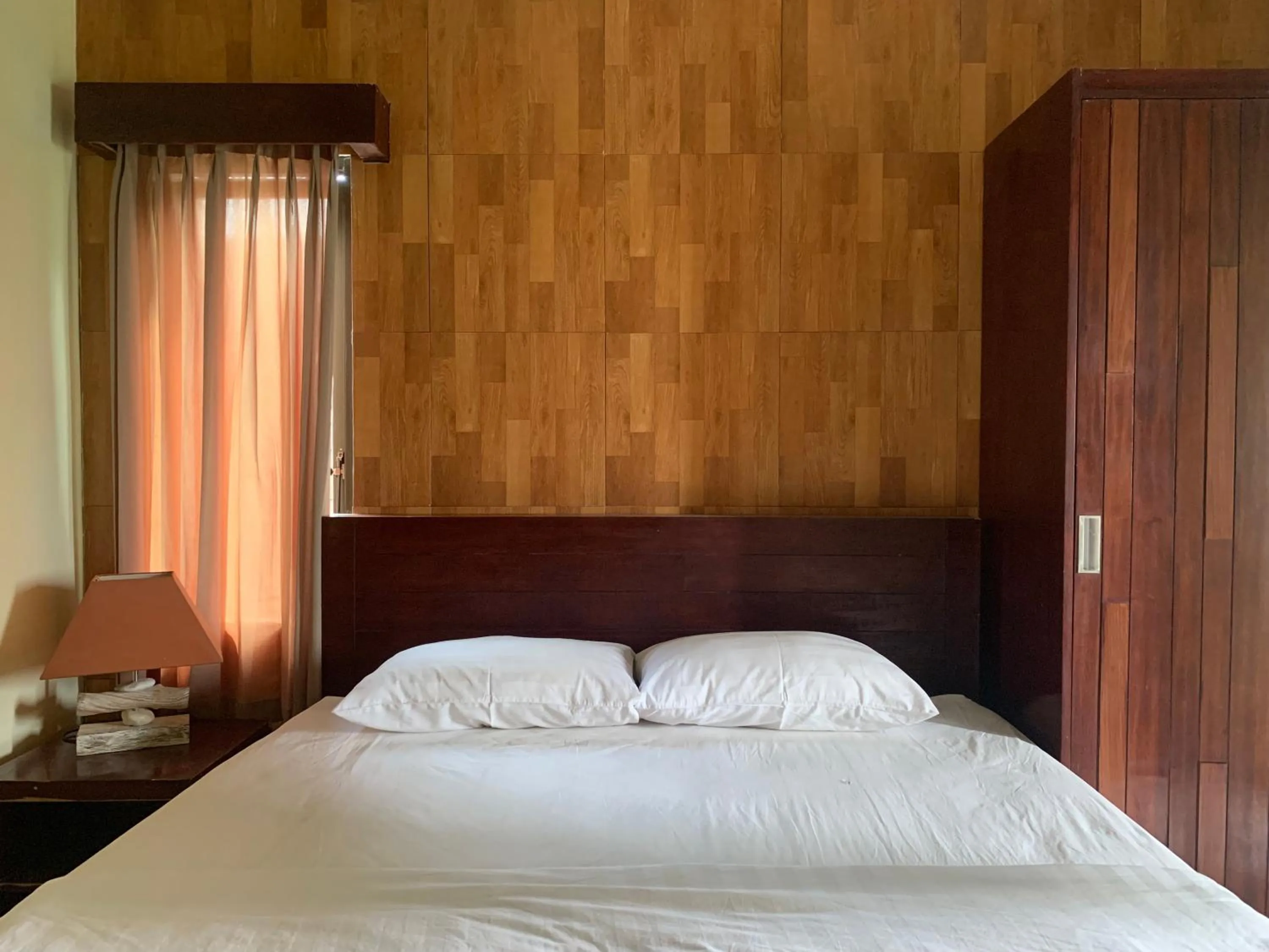 Bed in Cozy Palm Villa