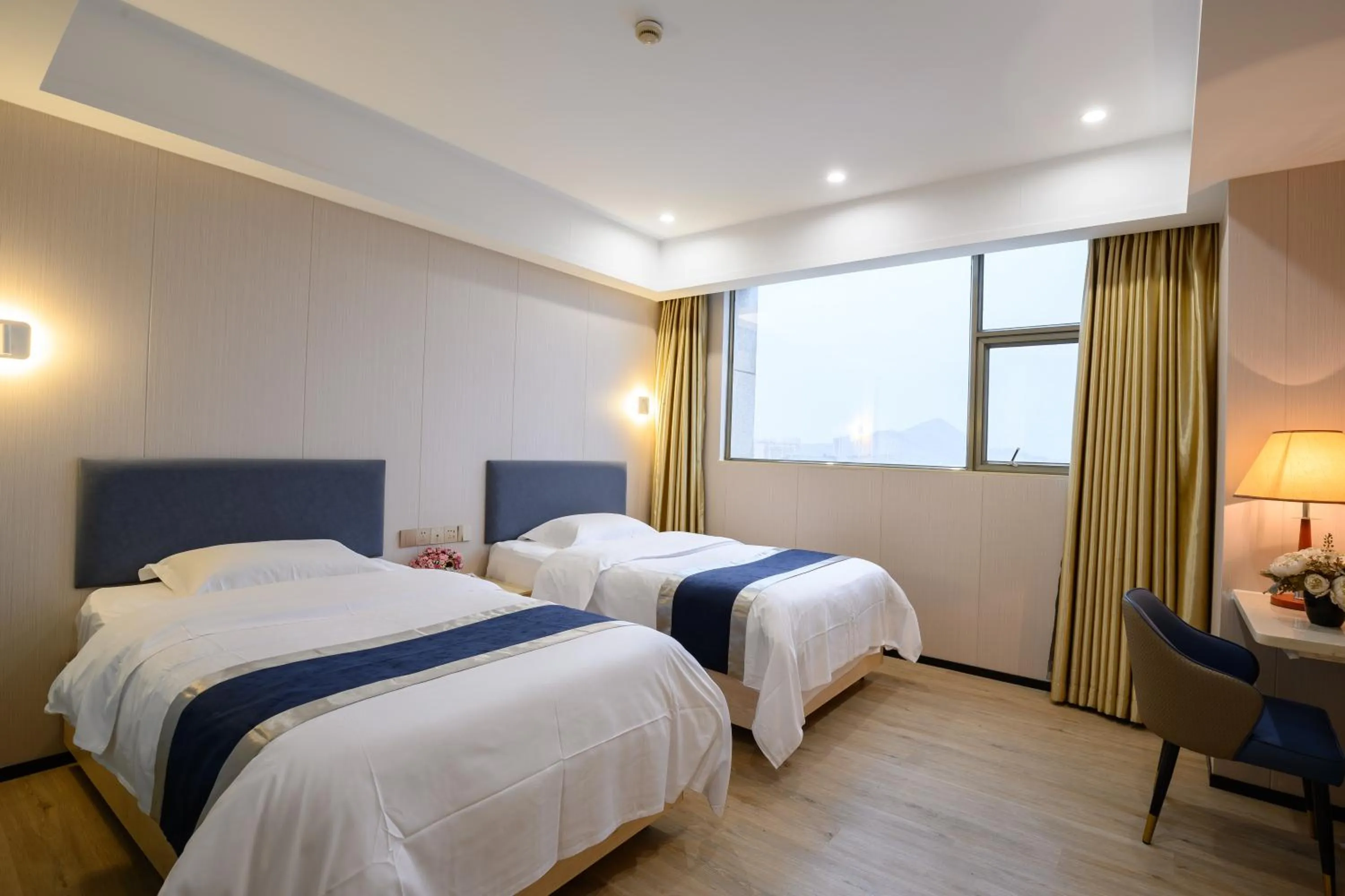 Bed in Green Island Holiday Hotel