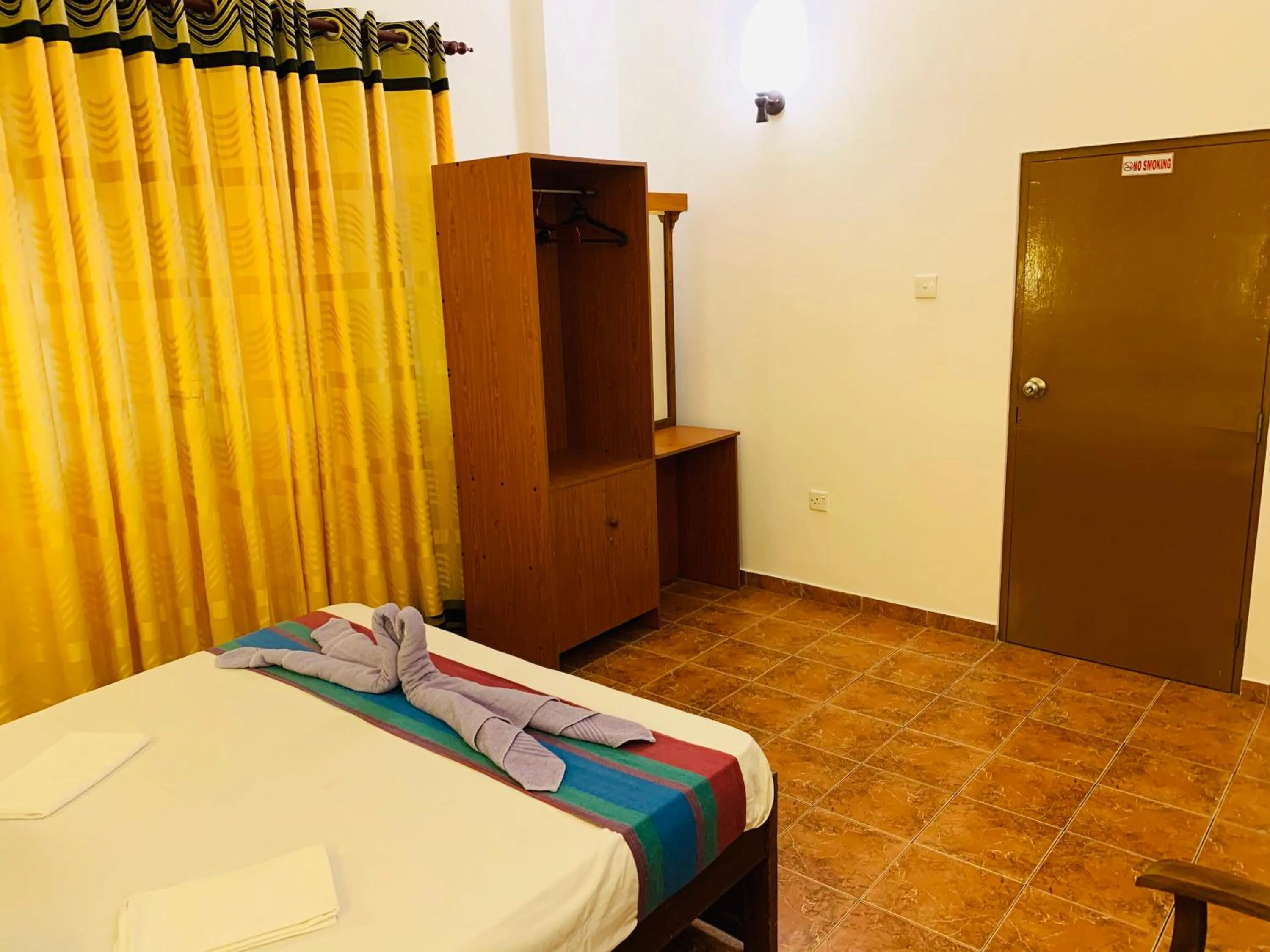 Photo of the whole room, Bed in Sam's Guest House