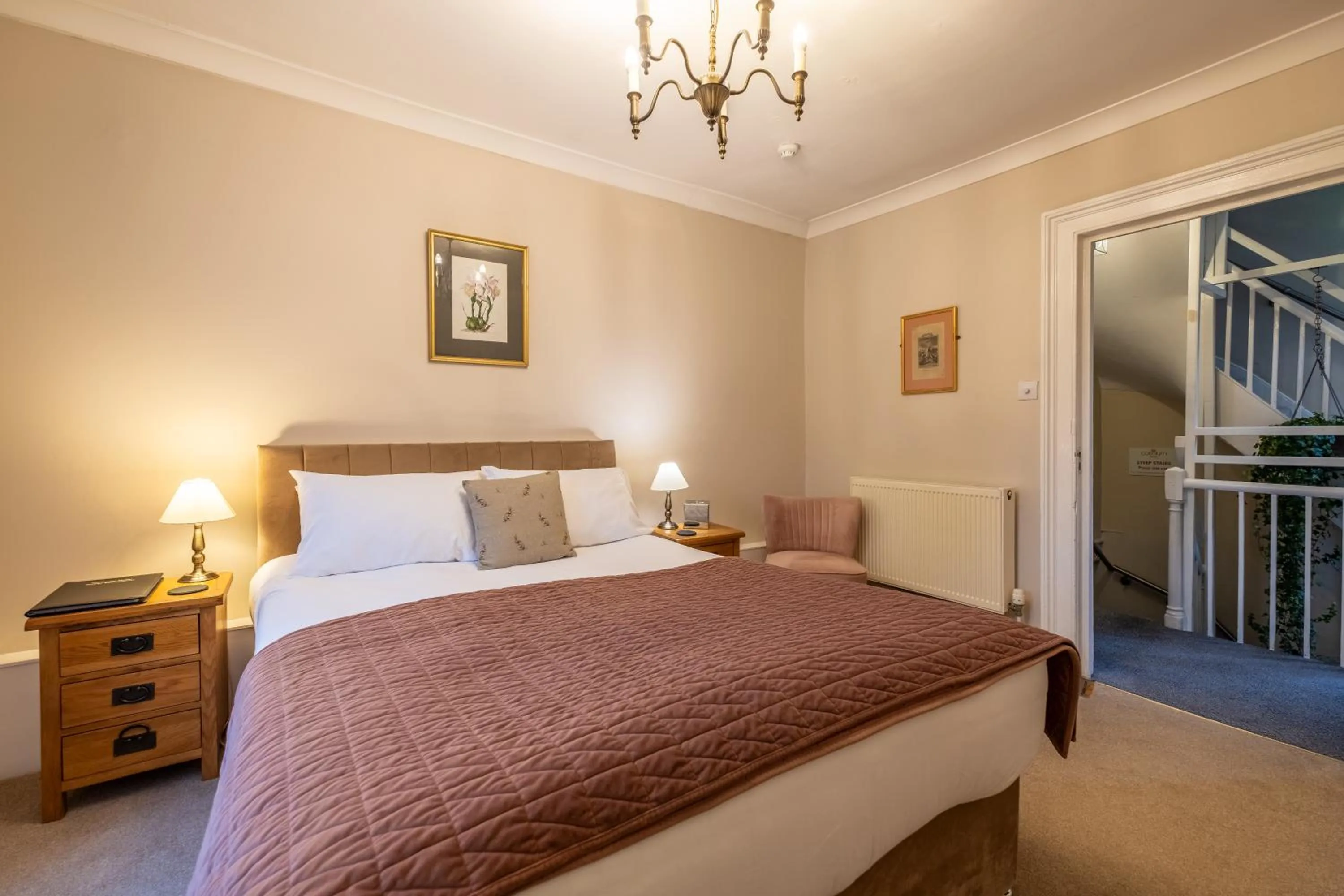 Bed in Corinium Hotel & Restaurant