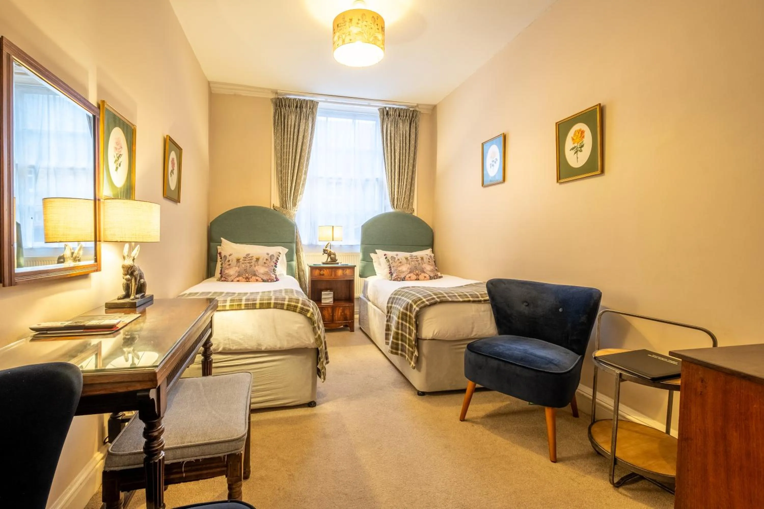 Bed in Corinium Hotel & Restaurant