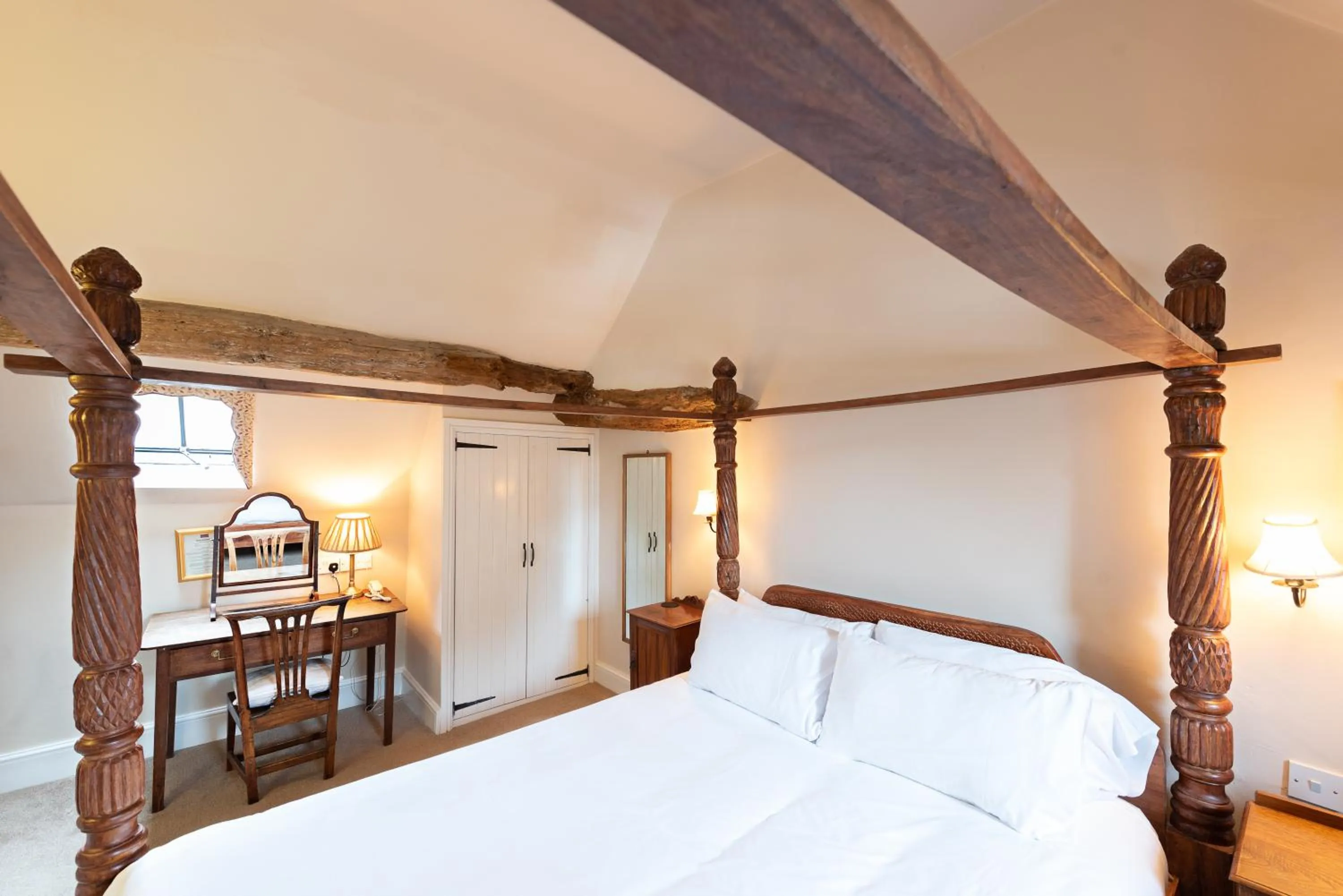 Bed in Corinium Hotel & Restaurant