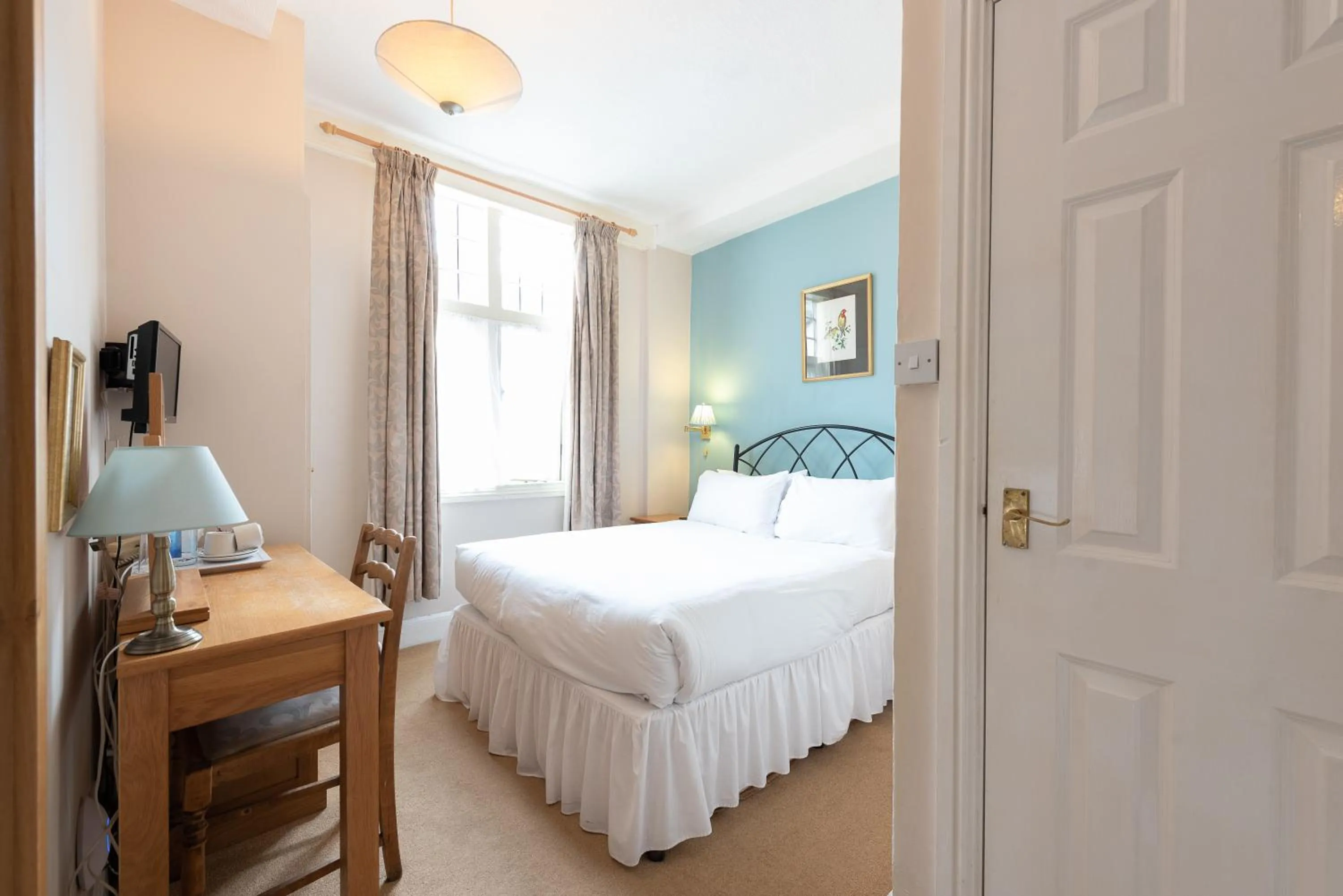 Bed in Corinium Hotel & Restaurant