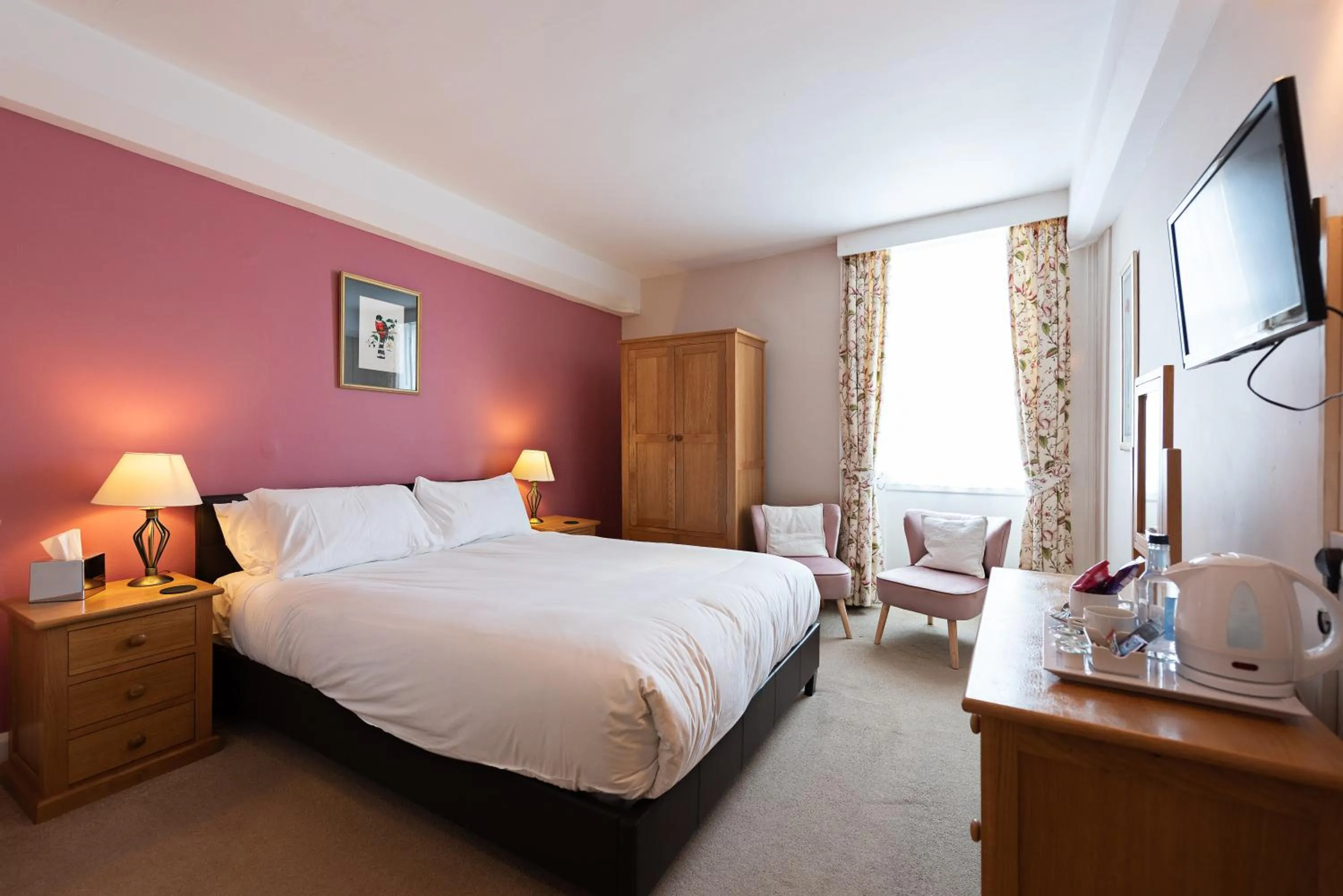 Bed in Corinium Hotel & Restaurant