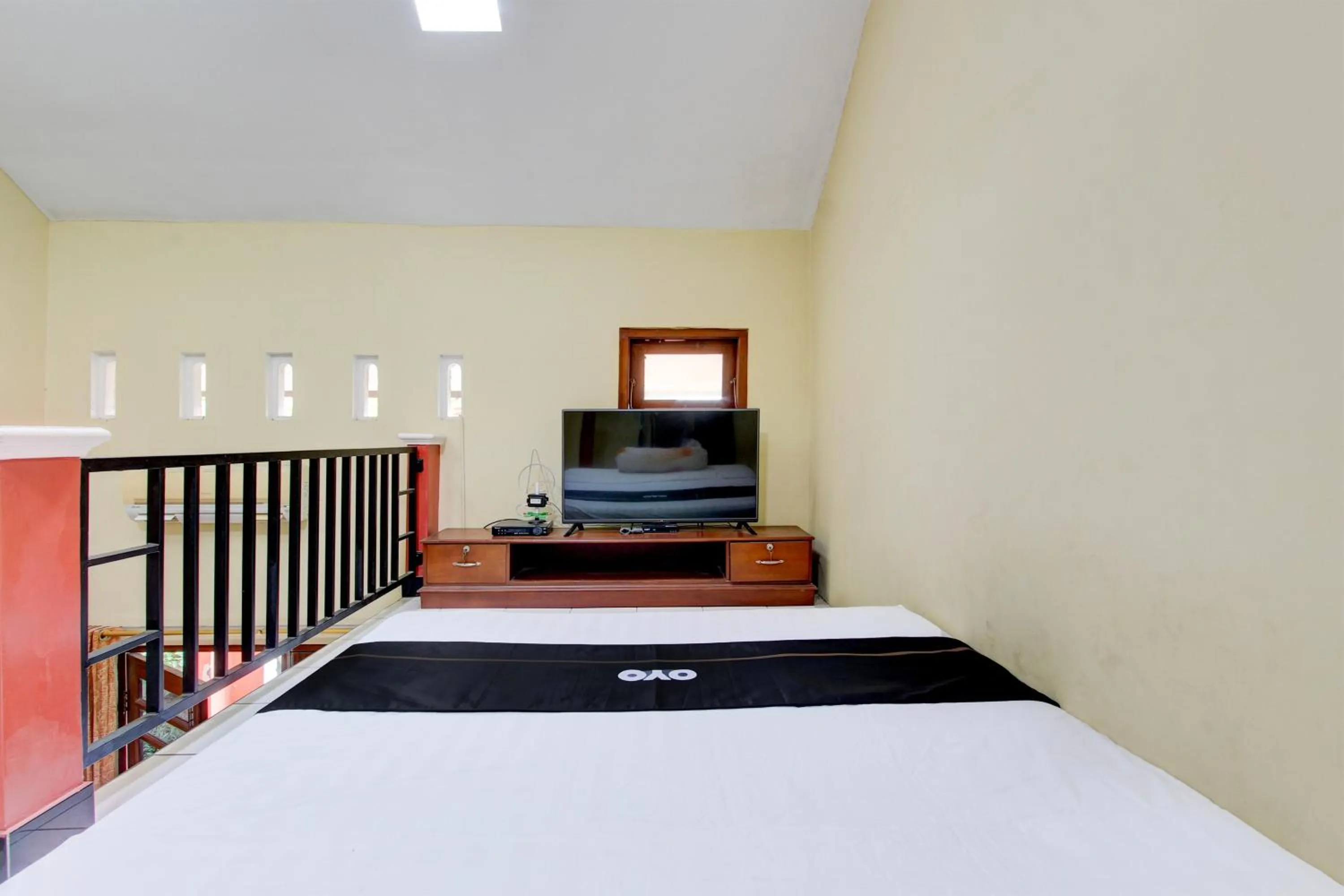 Bedroom in Capital O 93716 Family Guesthouse Syariah