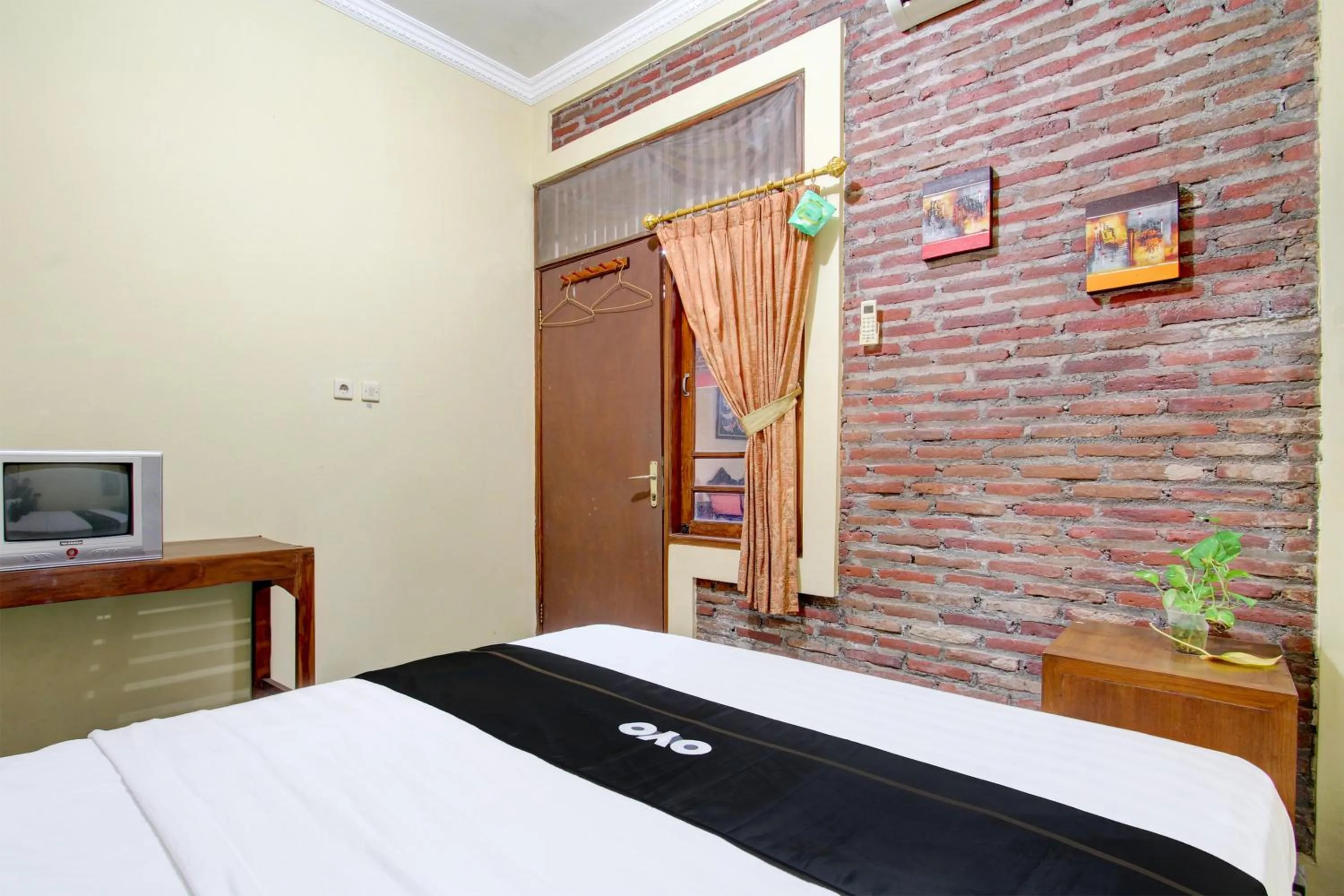 Bedroom in Capital O 93716 Family Guesthouse Syariah