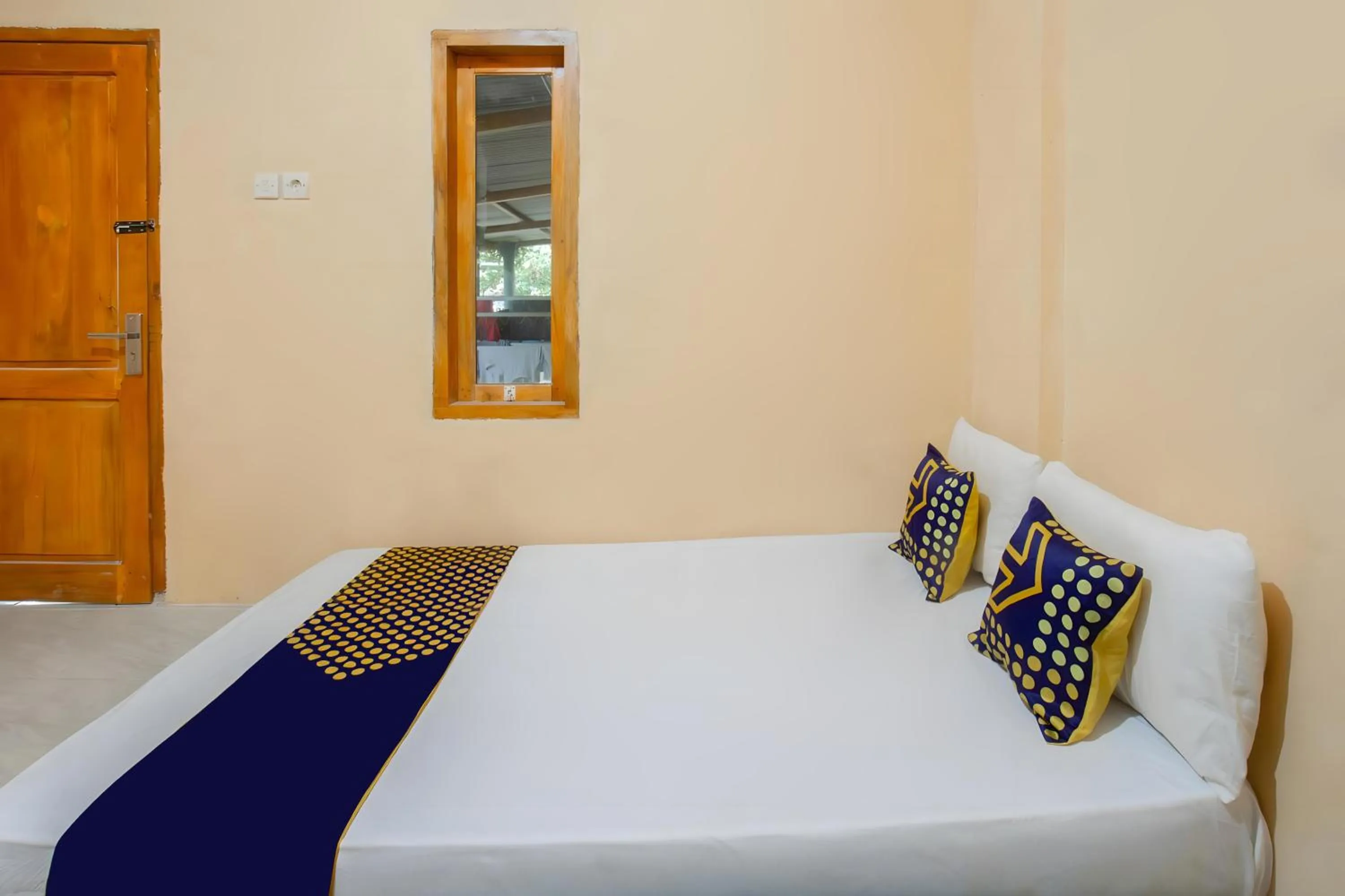 Bedroom, Bed in SPOT ON 93724 Songgong Homestay