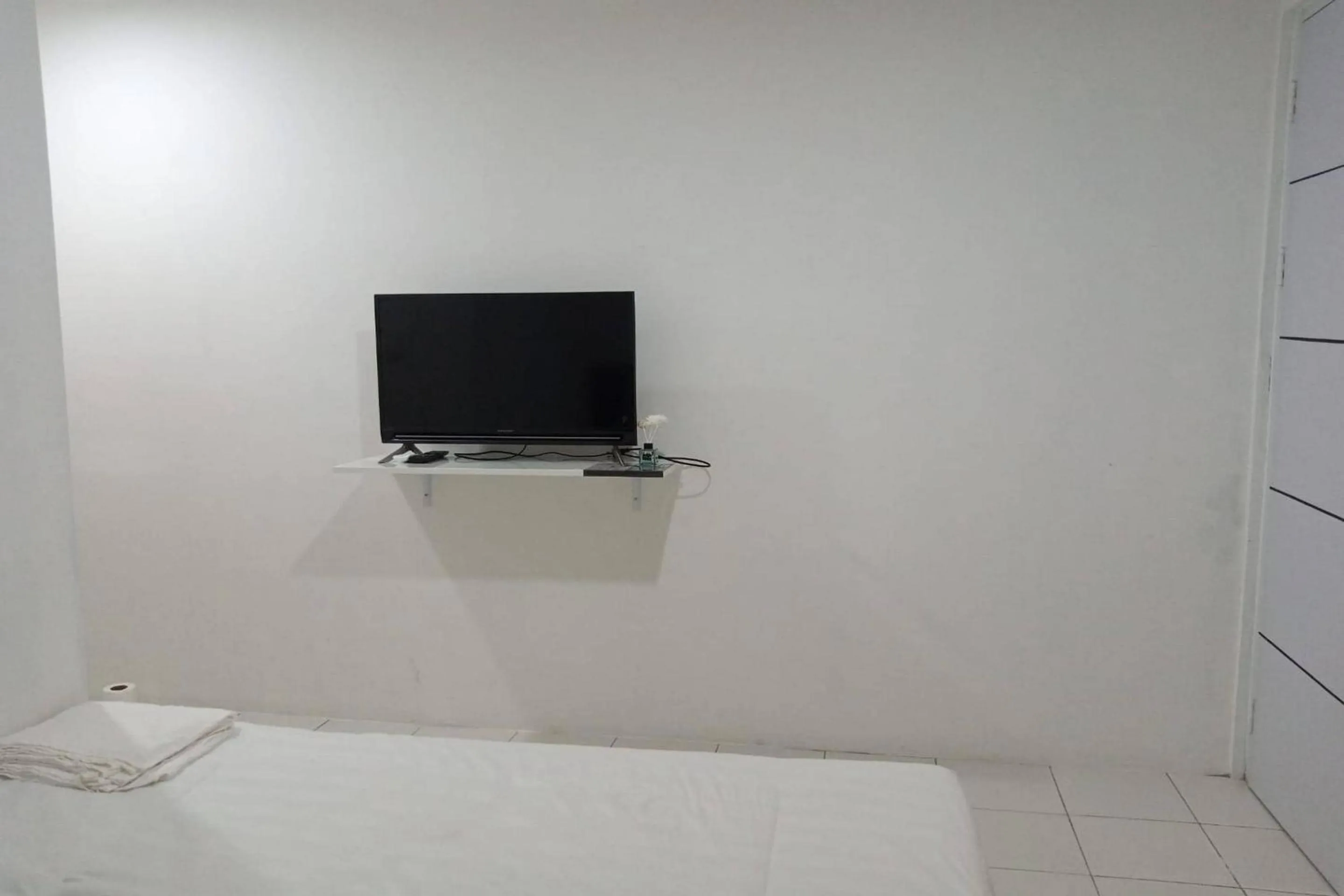 Bedroom in Capital O 93728 Guest House Cemara