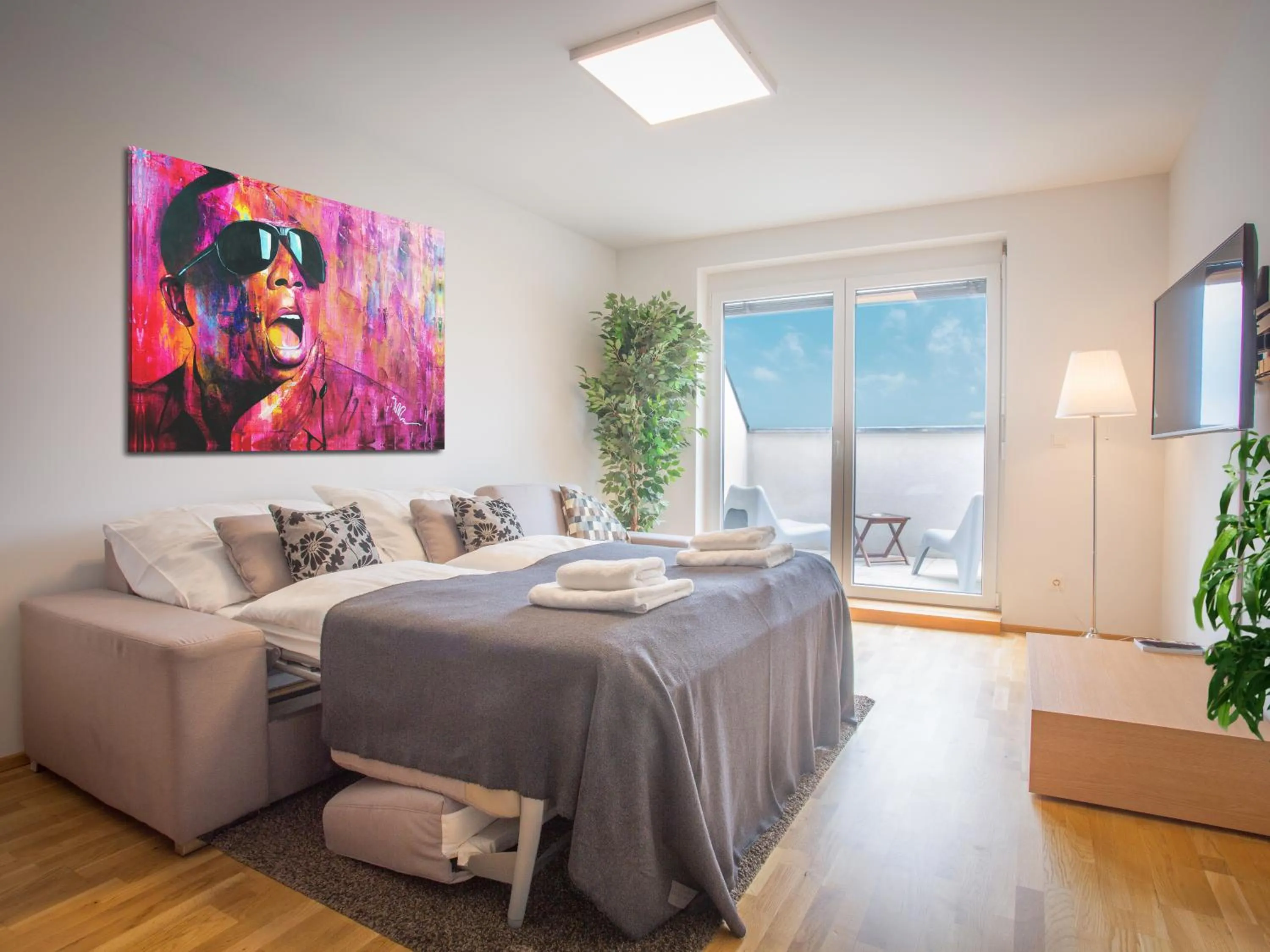 Bed in Penthouse Apartments