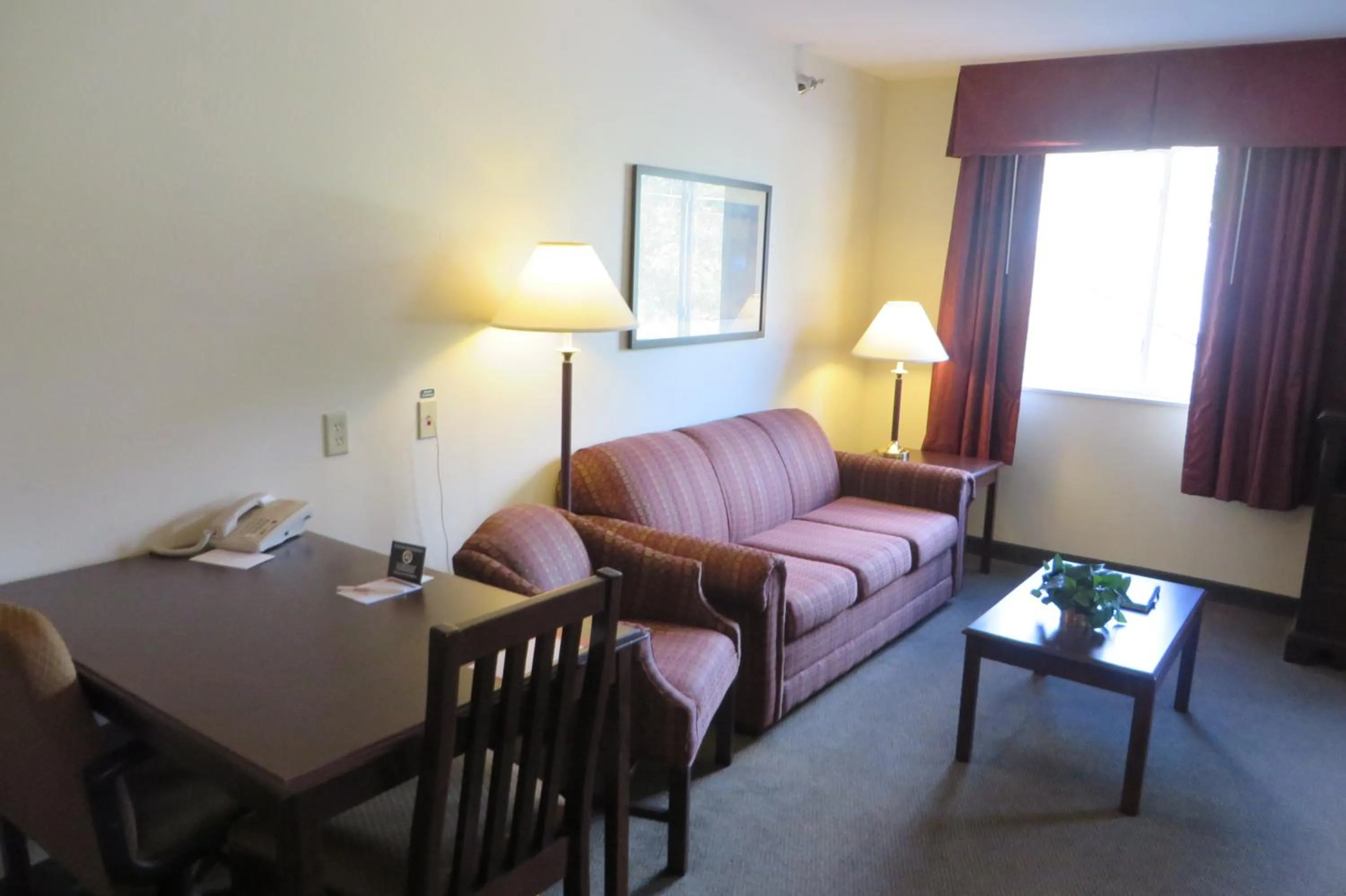 Living room, Bed in Hawthorn Extended Stay by Wyndham Seville