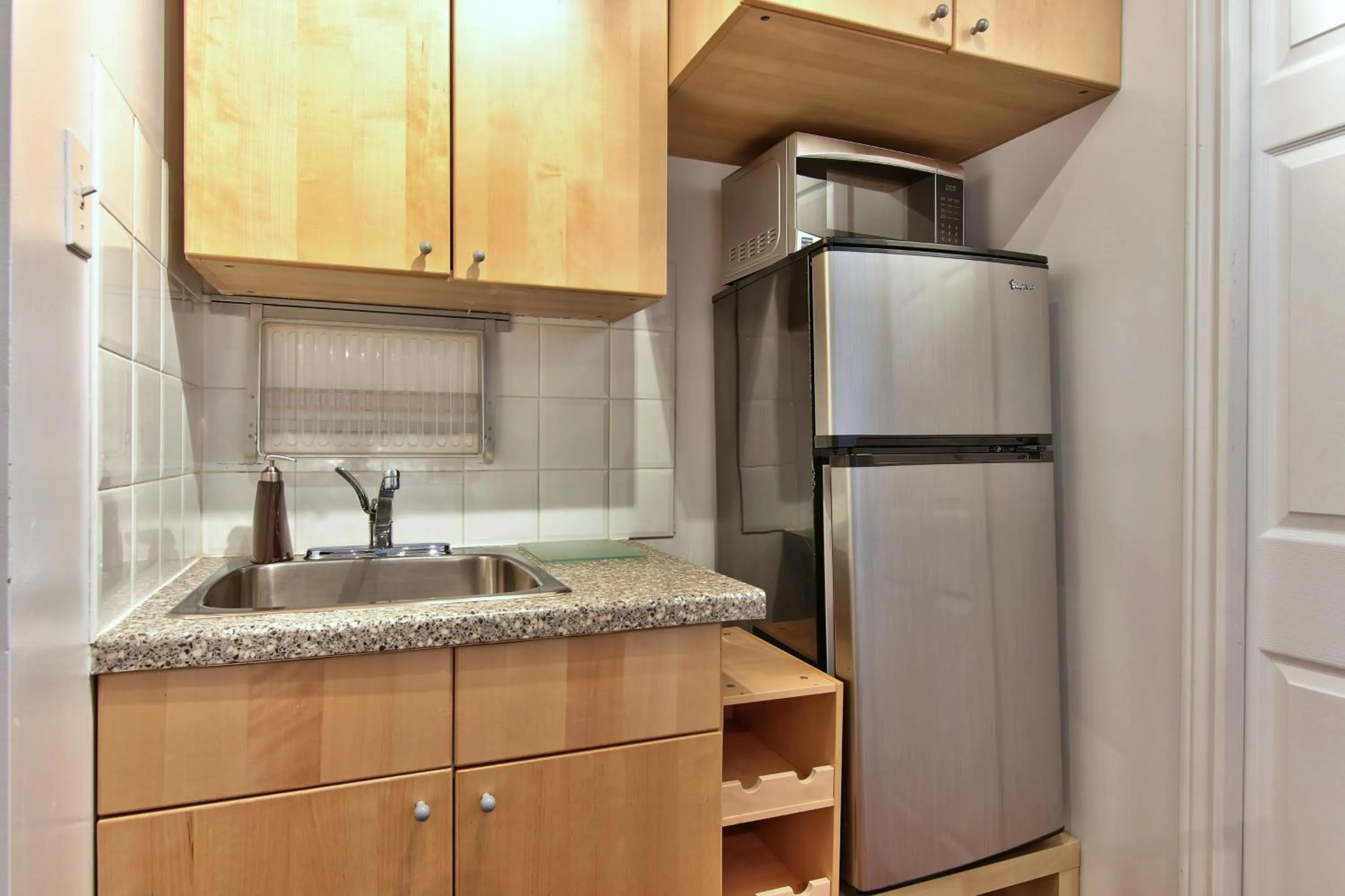 Kitchen or kitchenette in Apartment et Studio montreal