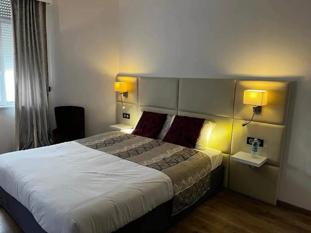 Bed in Hôtel de la Paix