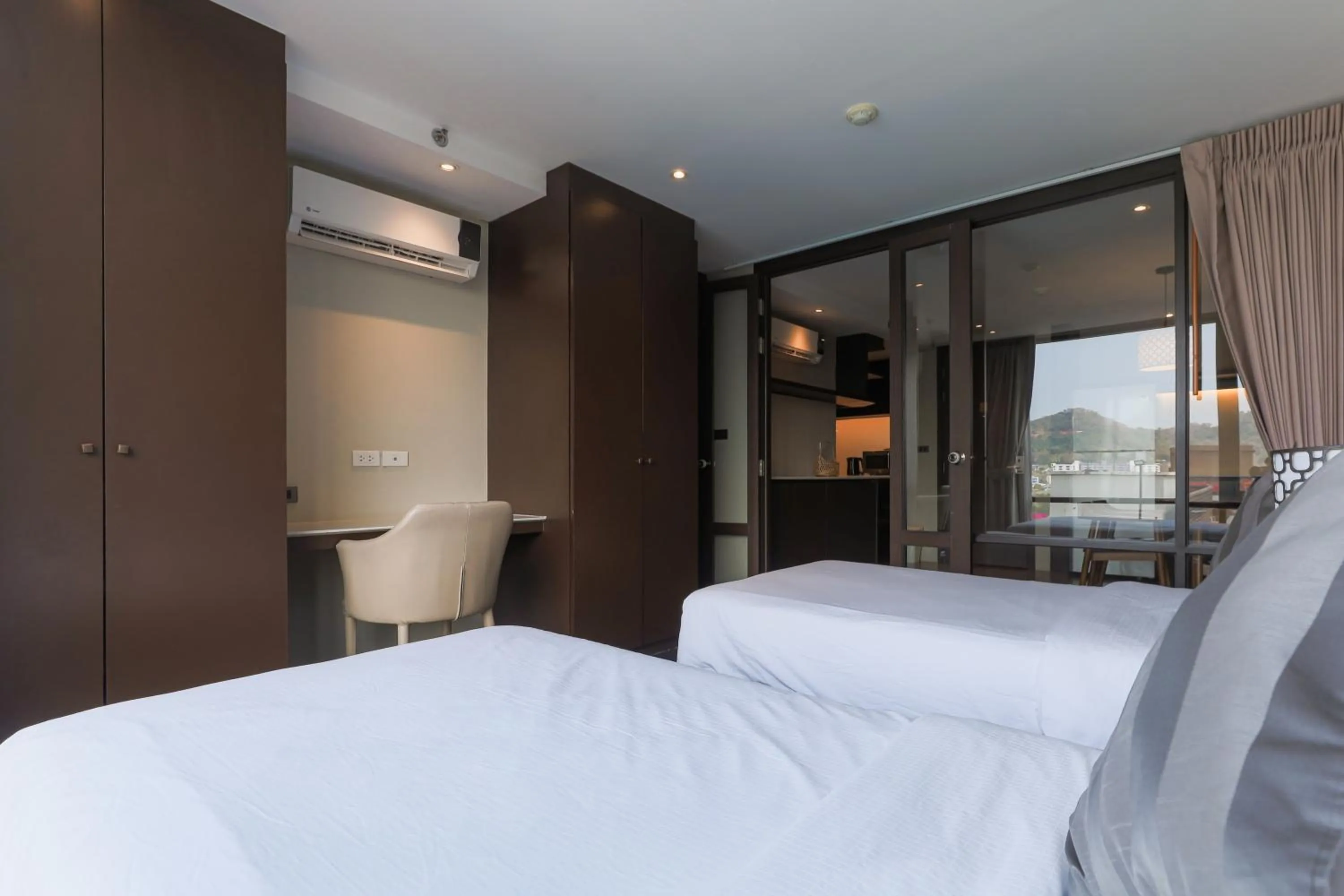 Bed in Balcony Courtyard Sriracha Hotel & Serviced Apartments