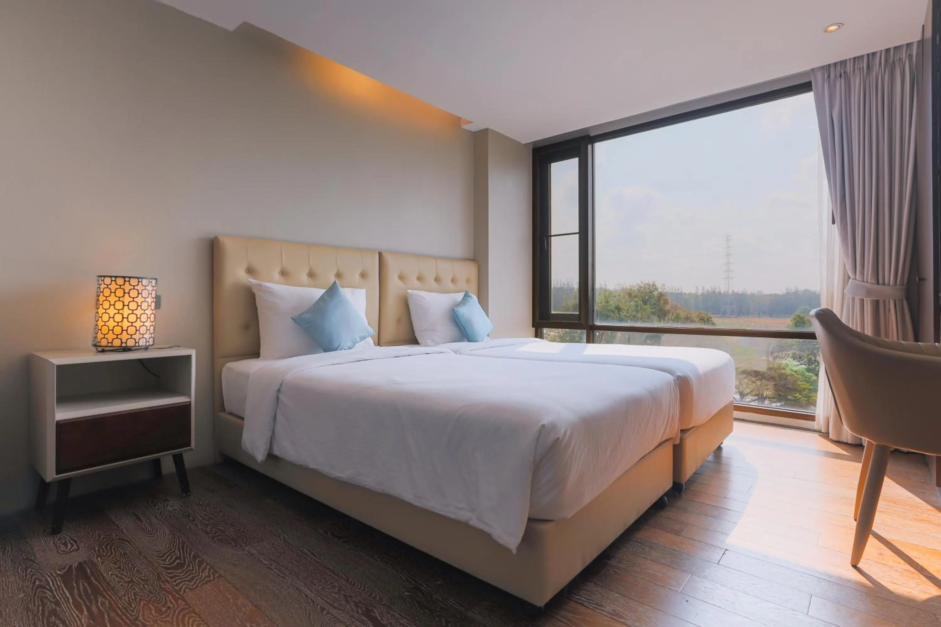 Bed in Balcony Courtyard Sriracha Hotel & Serviced Apartments