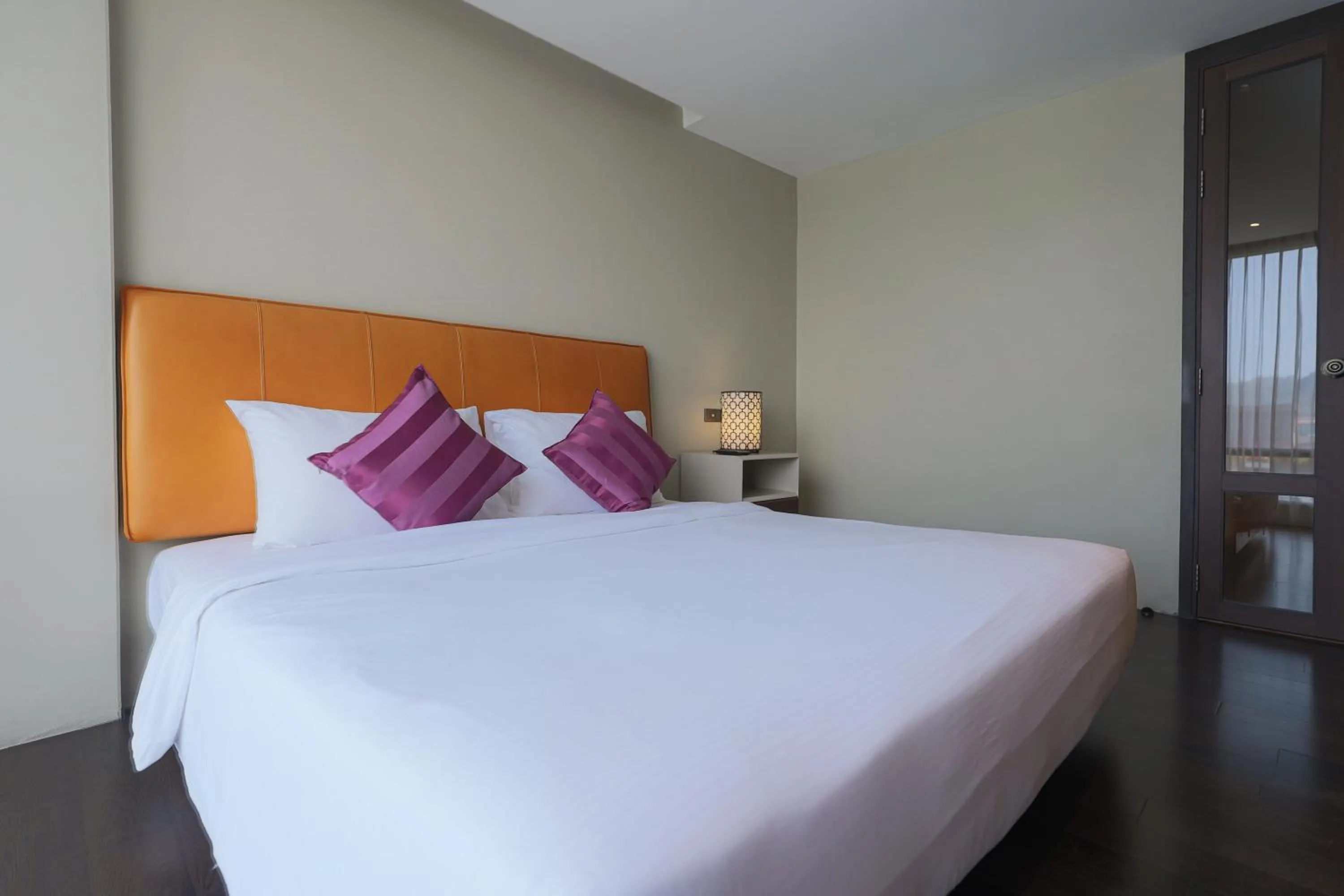 Bed in Balcony Courtyard Sriracha Hotel & Serviced Apartments