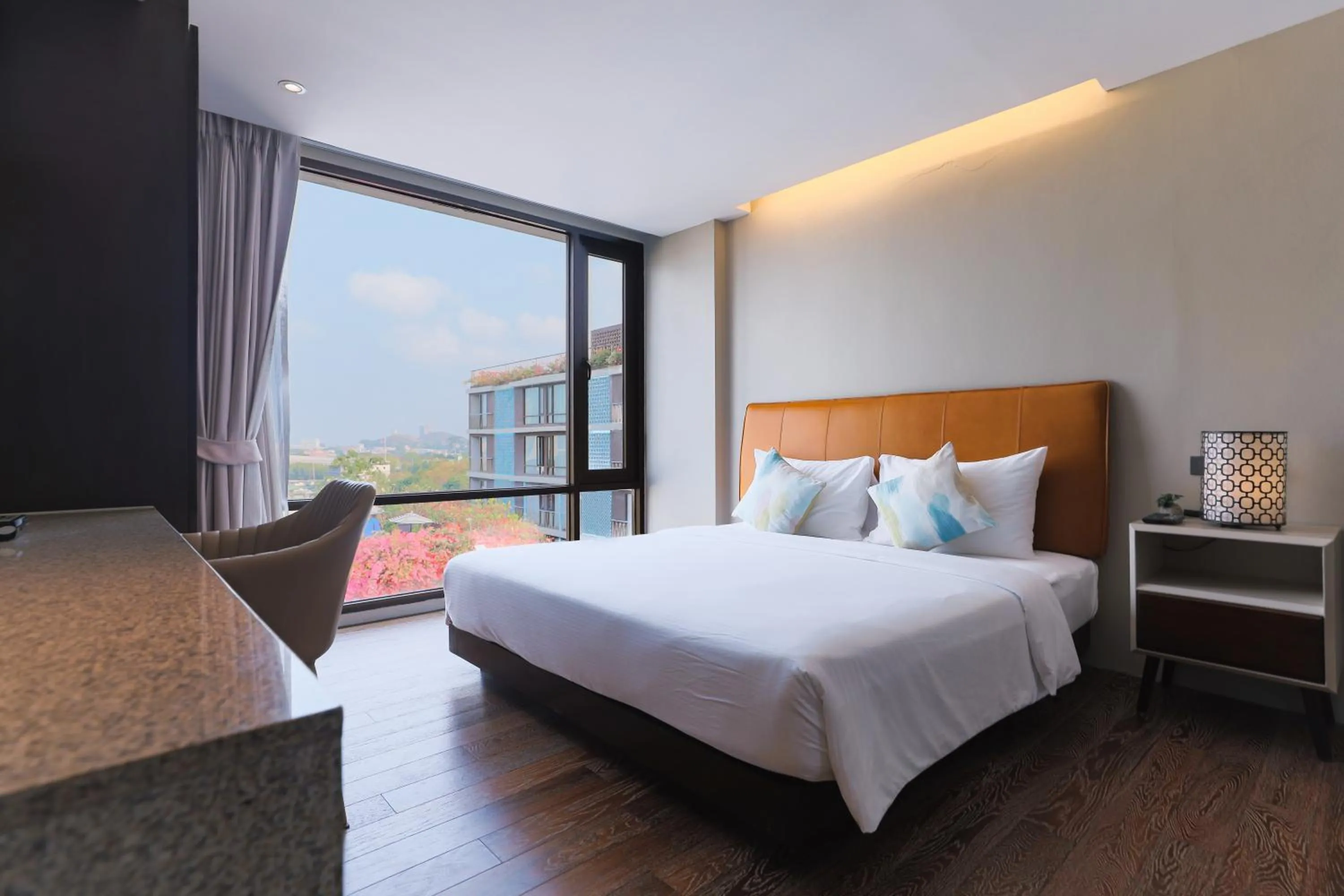 Bed in Balcony Courtyard Sriracha Hotel & Serviced Apartments