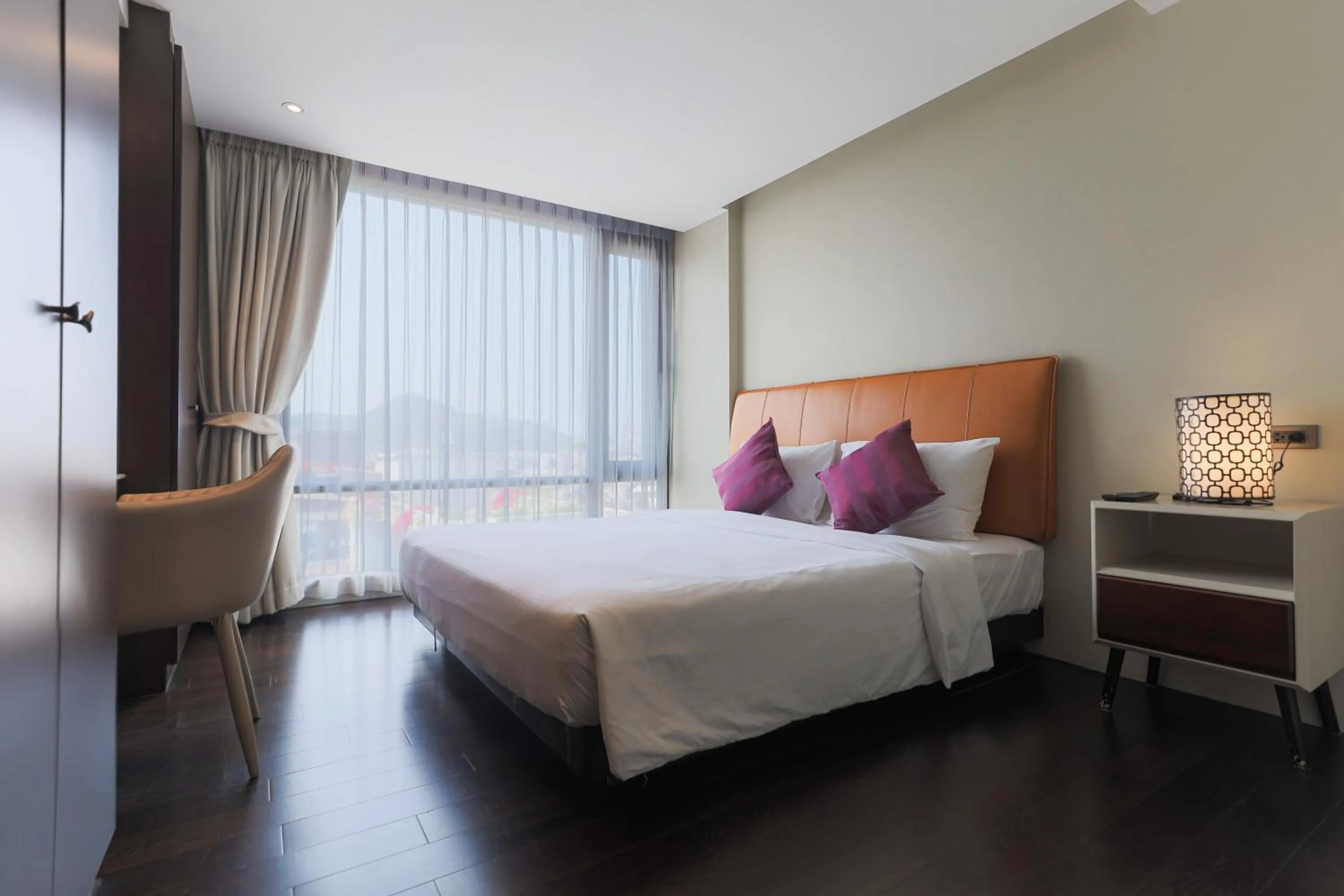 Bed in Balcony Courtyard Sriracha Hotel & Serviced Apartments
