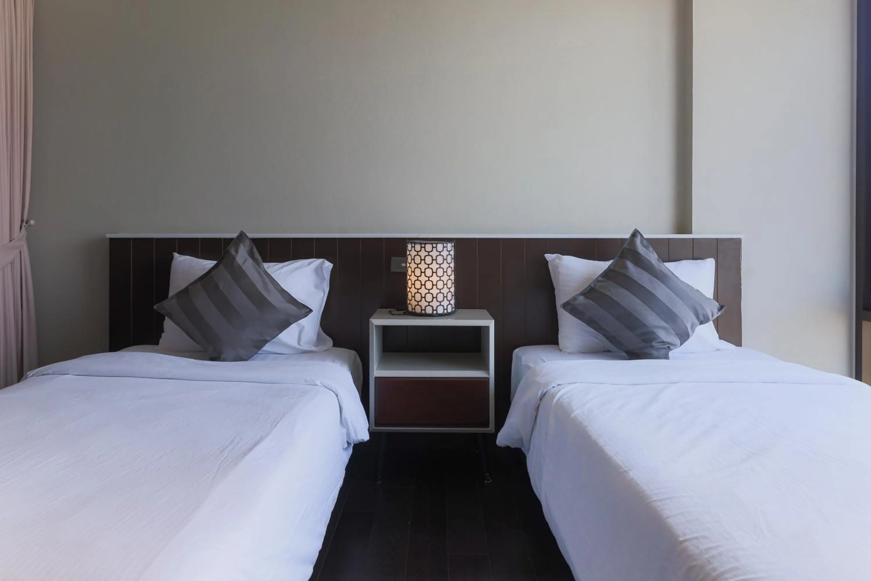 Bed in Balcony Courtyard Sriracha Hotel & Serviced Apartments