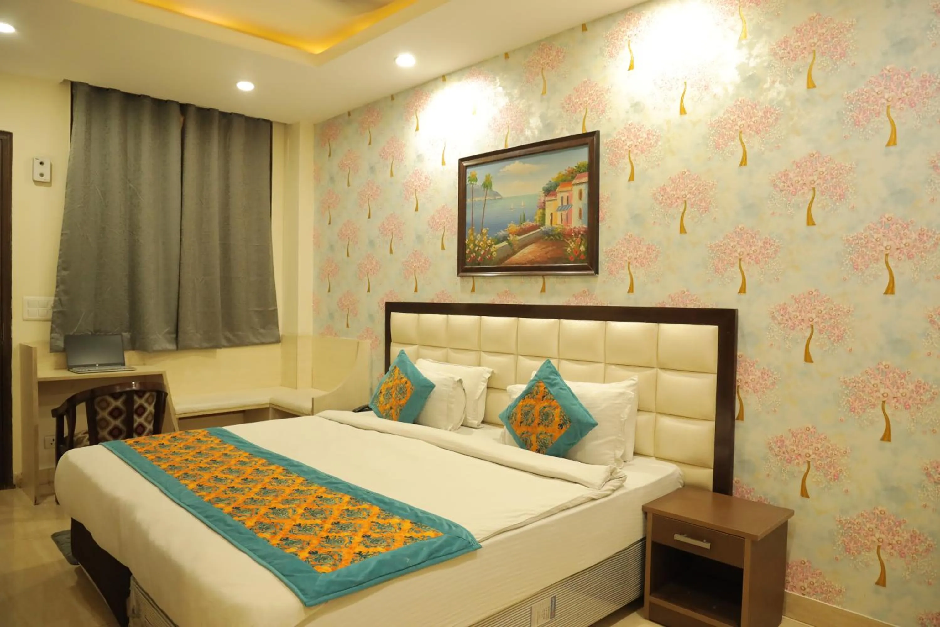 Bed in Hotel Nirvana Suites