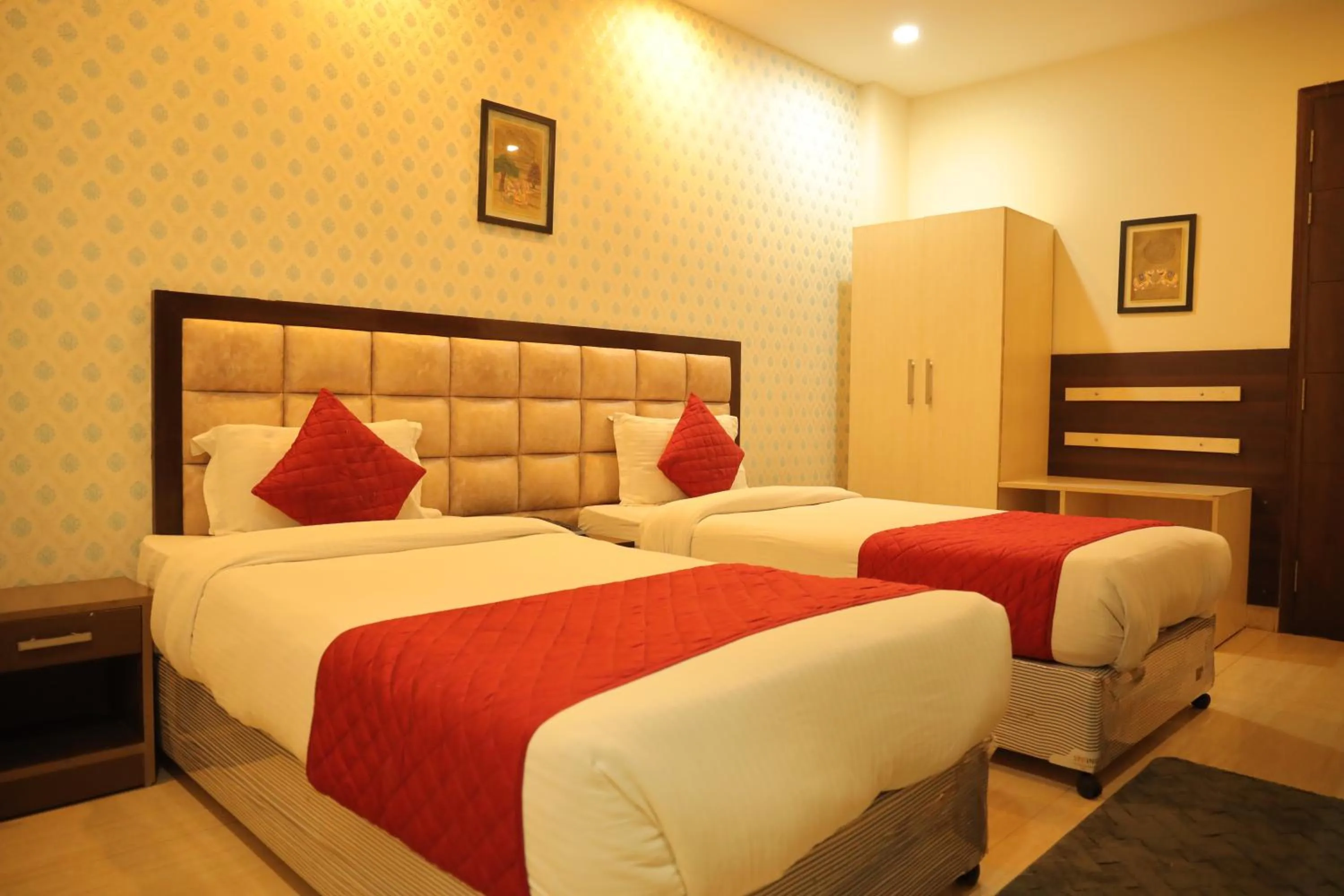 Bed in Hotel Nirvana Suites