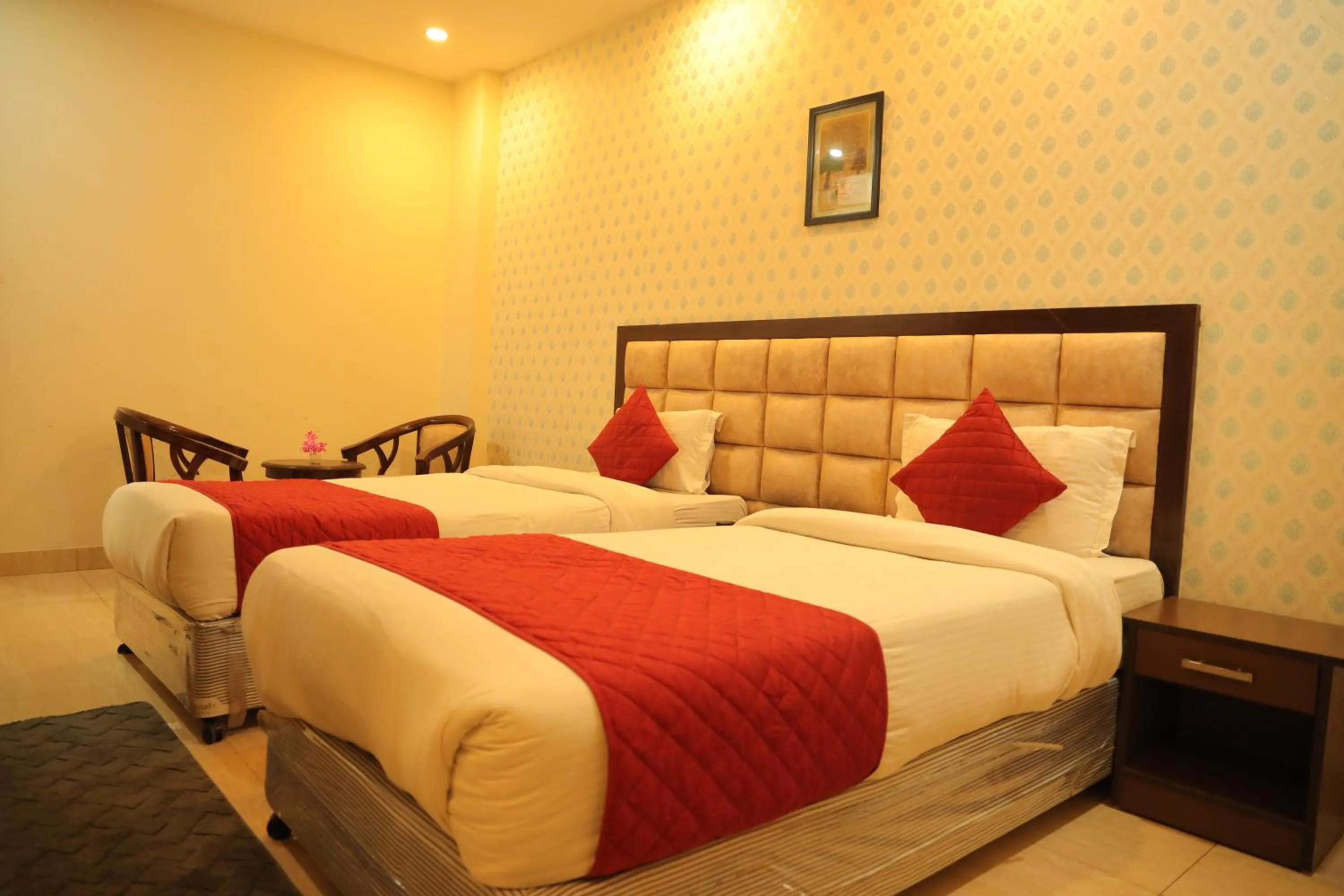 Bed in Hotel Nirvana Suites