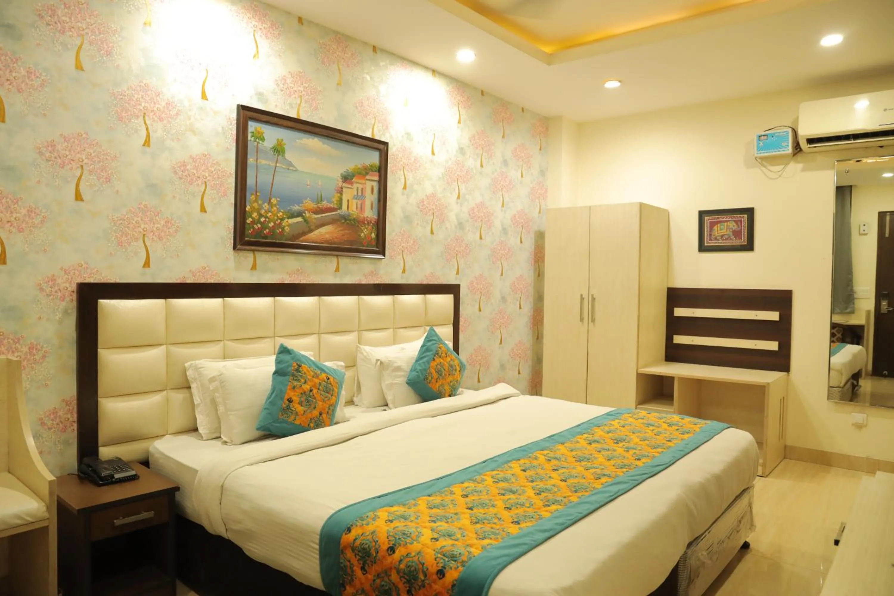 Bed in Hotel Nirvana Suites