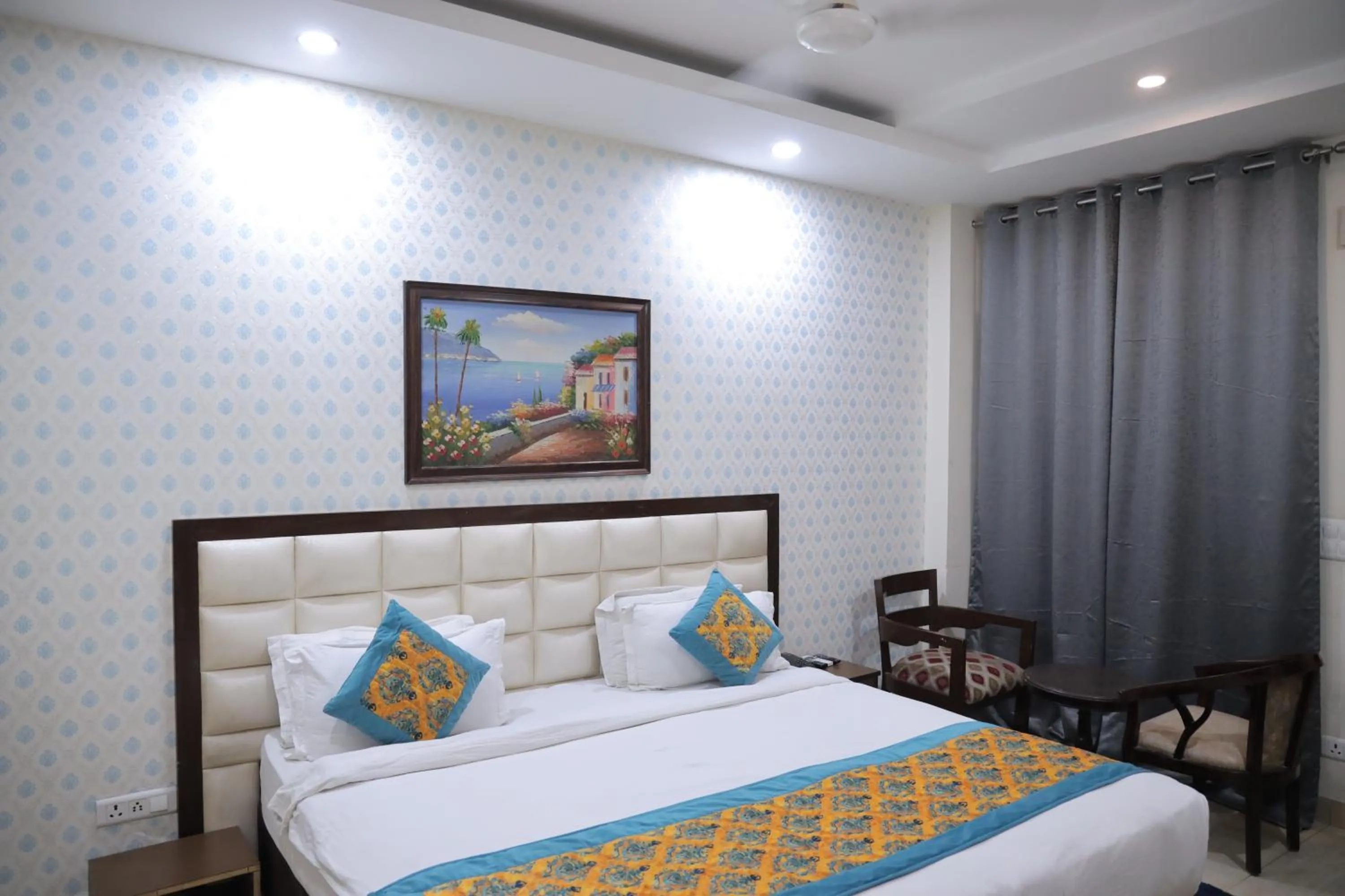 Bed in Hotel Nirvana Suites