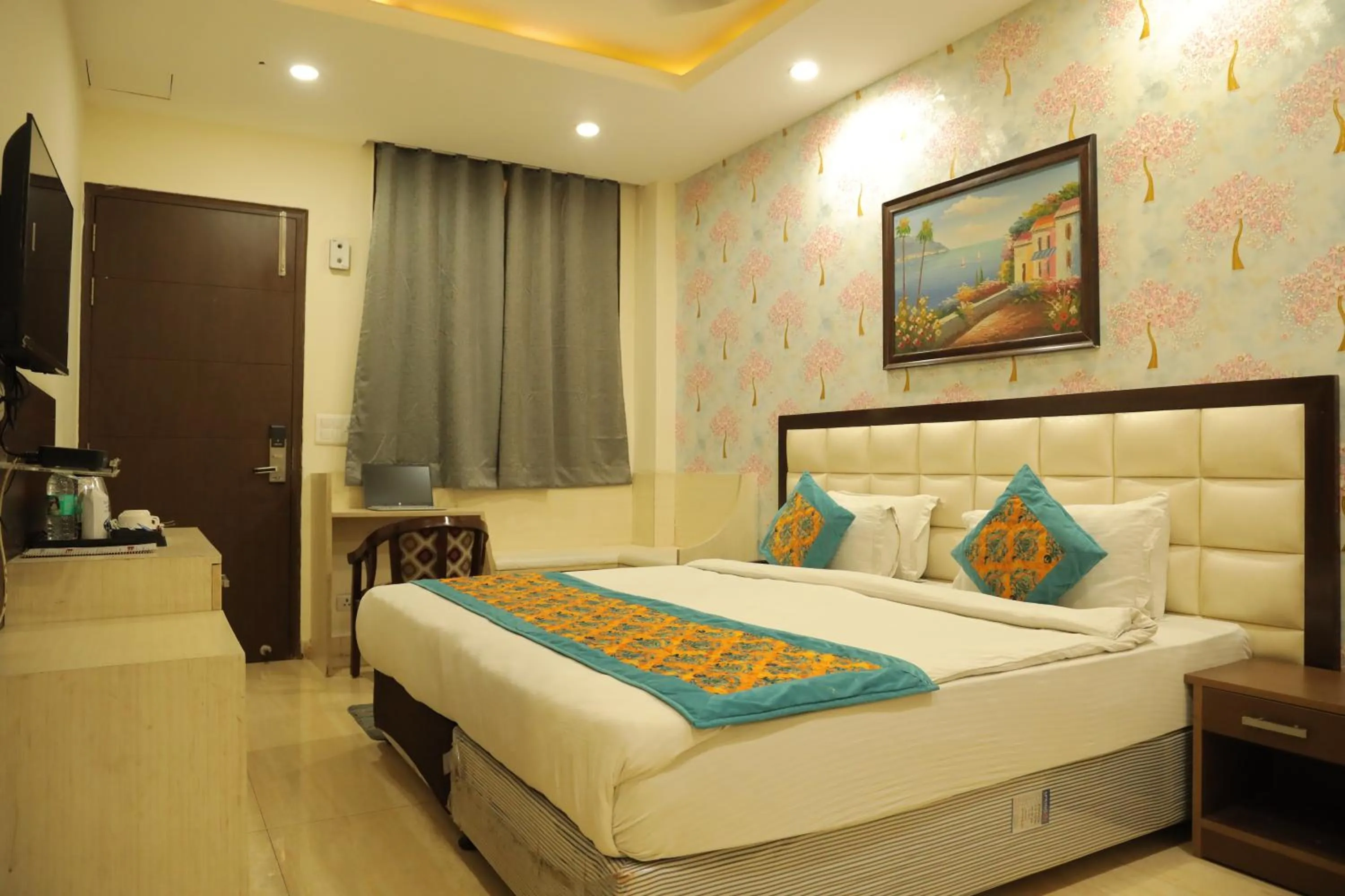 Bed in Hotel Nirvana Suites