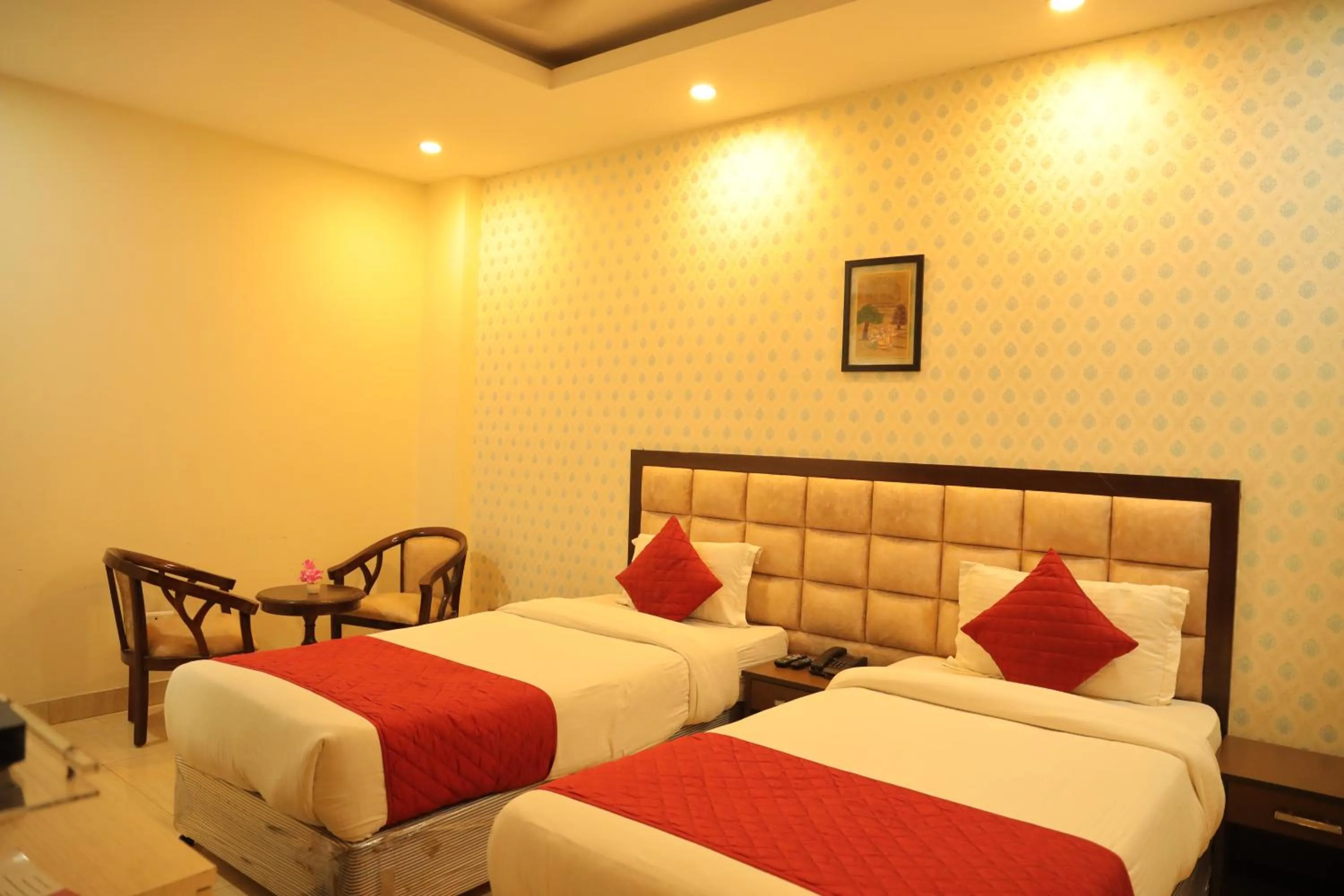 Bed in Hotel Nirvana Suites