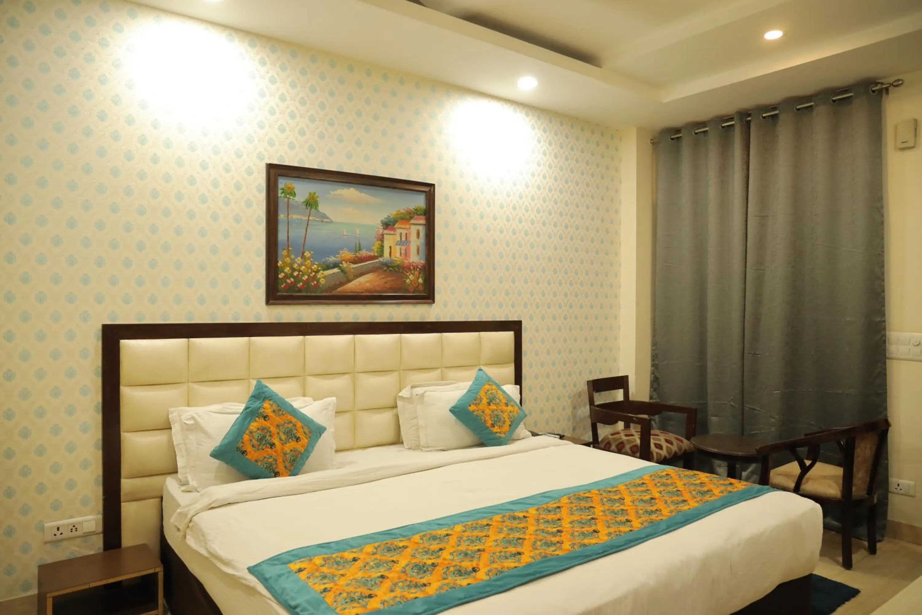 Bed in Hotel Nirvana Suites