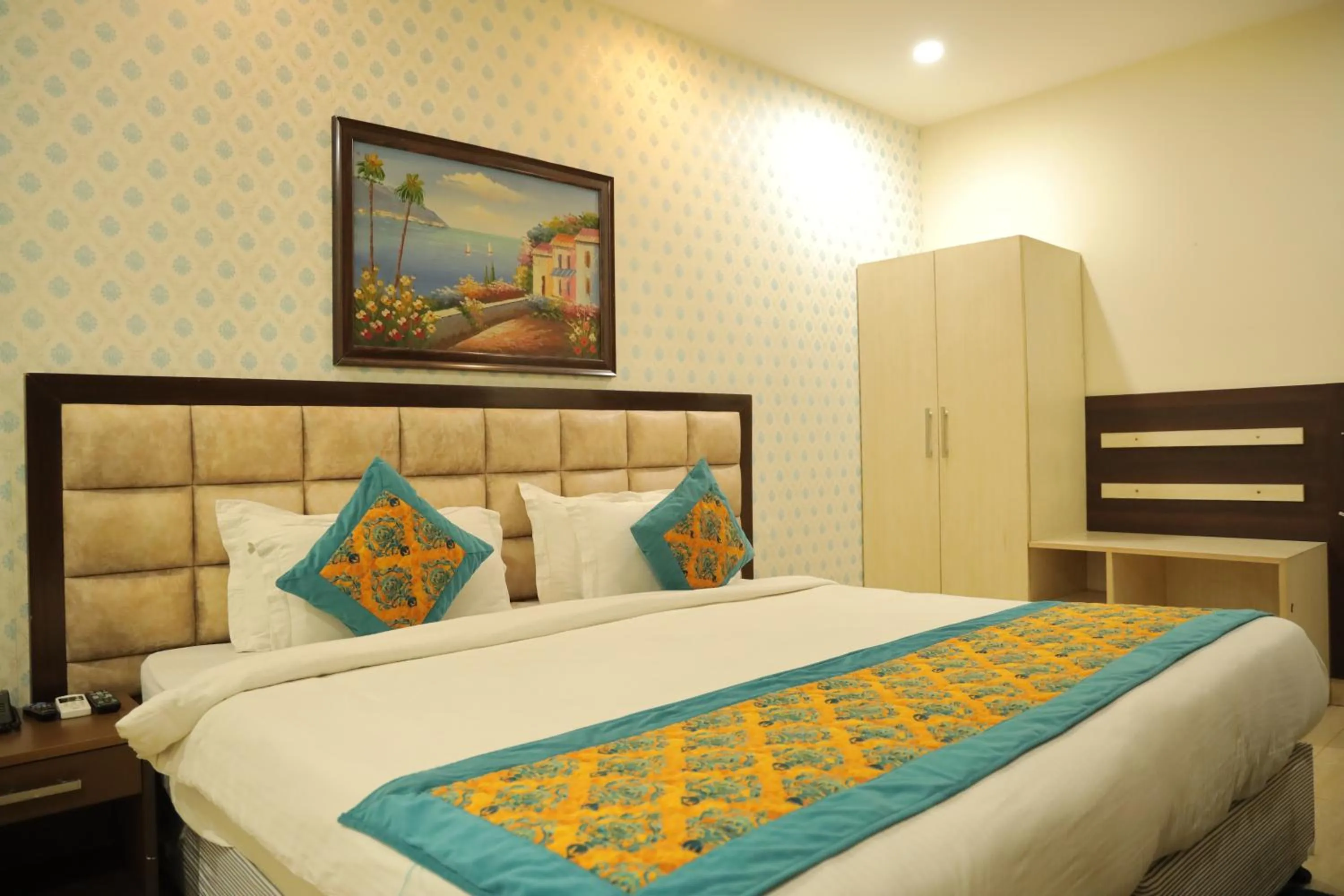 Photo of the whole room, Bed in Hotel Nirvana Suites