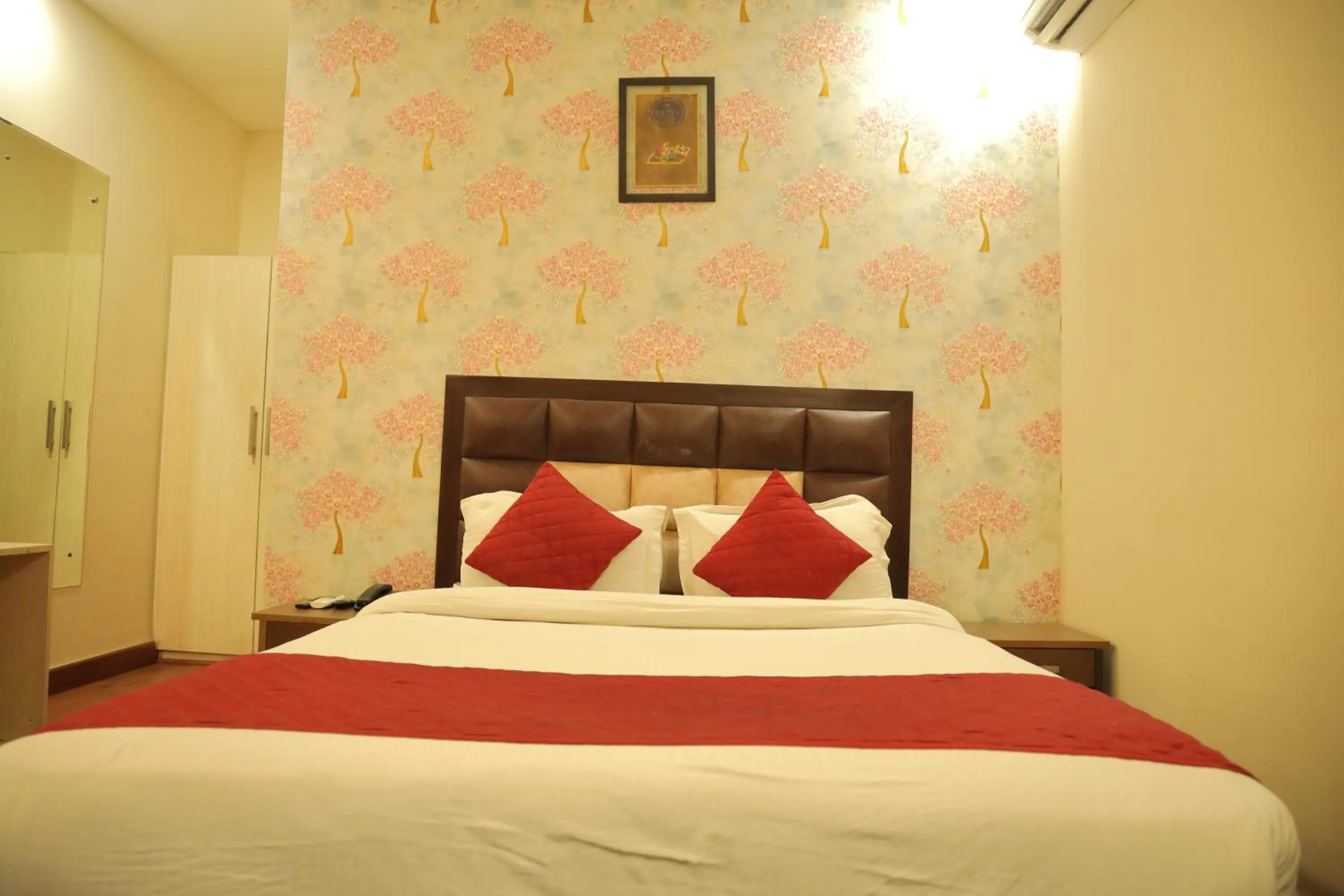 Bed in Hotel Nirvana Suites