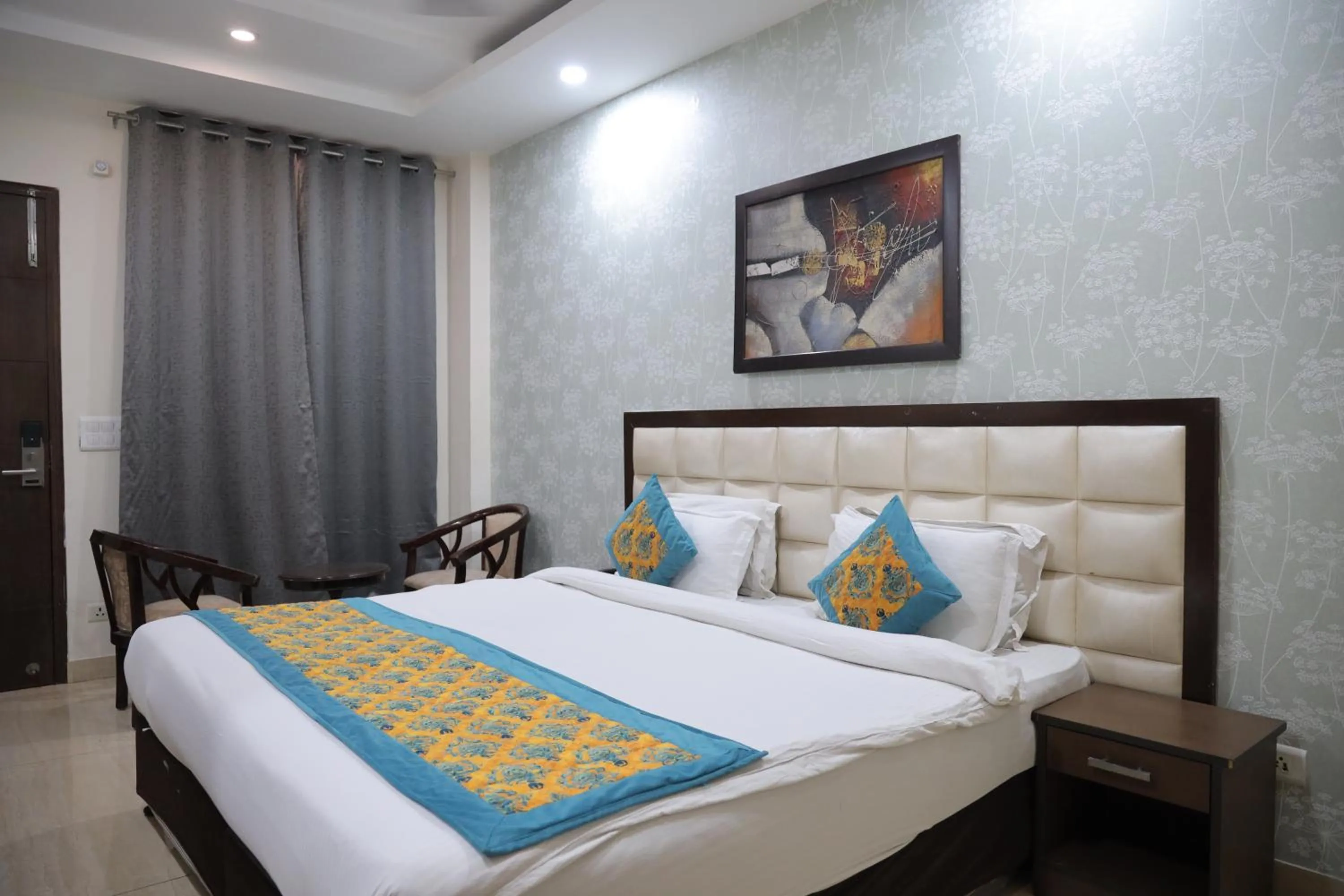 Bed in Hotel Nirvana Suites