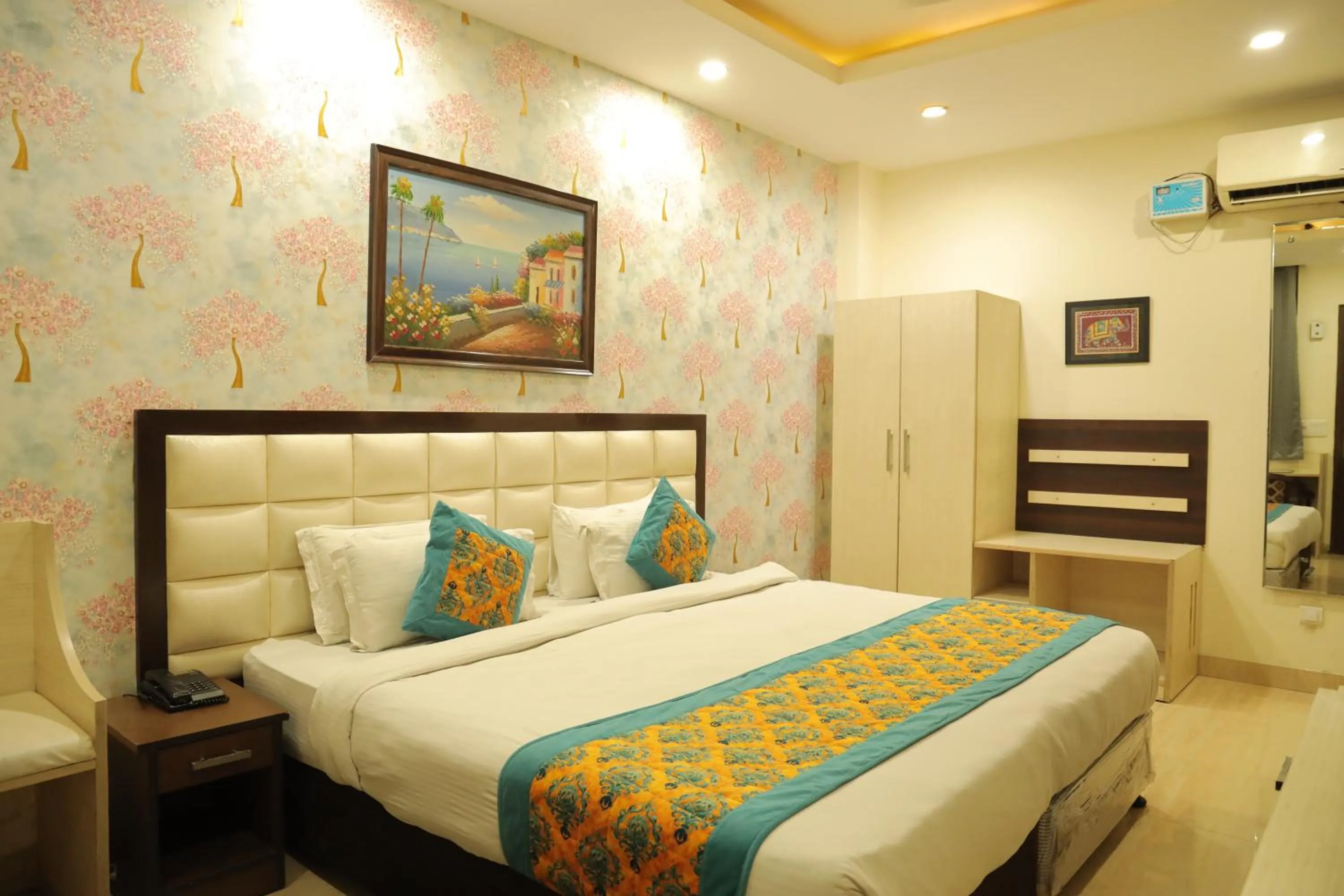 Bed in Hotel Nirvana Suites