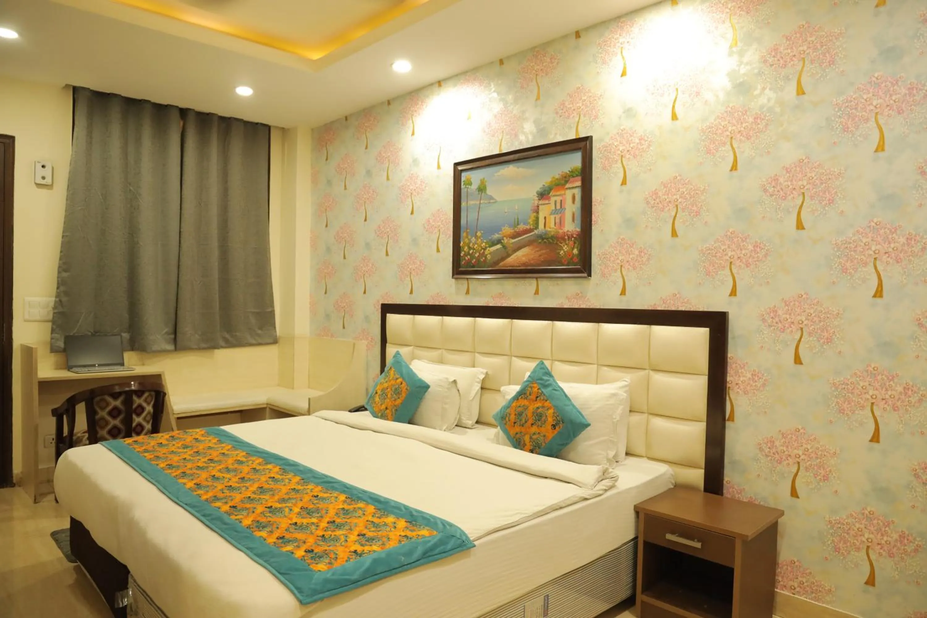 Bed in Hotel Nirvana Suites